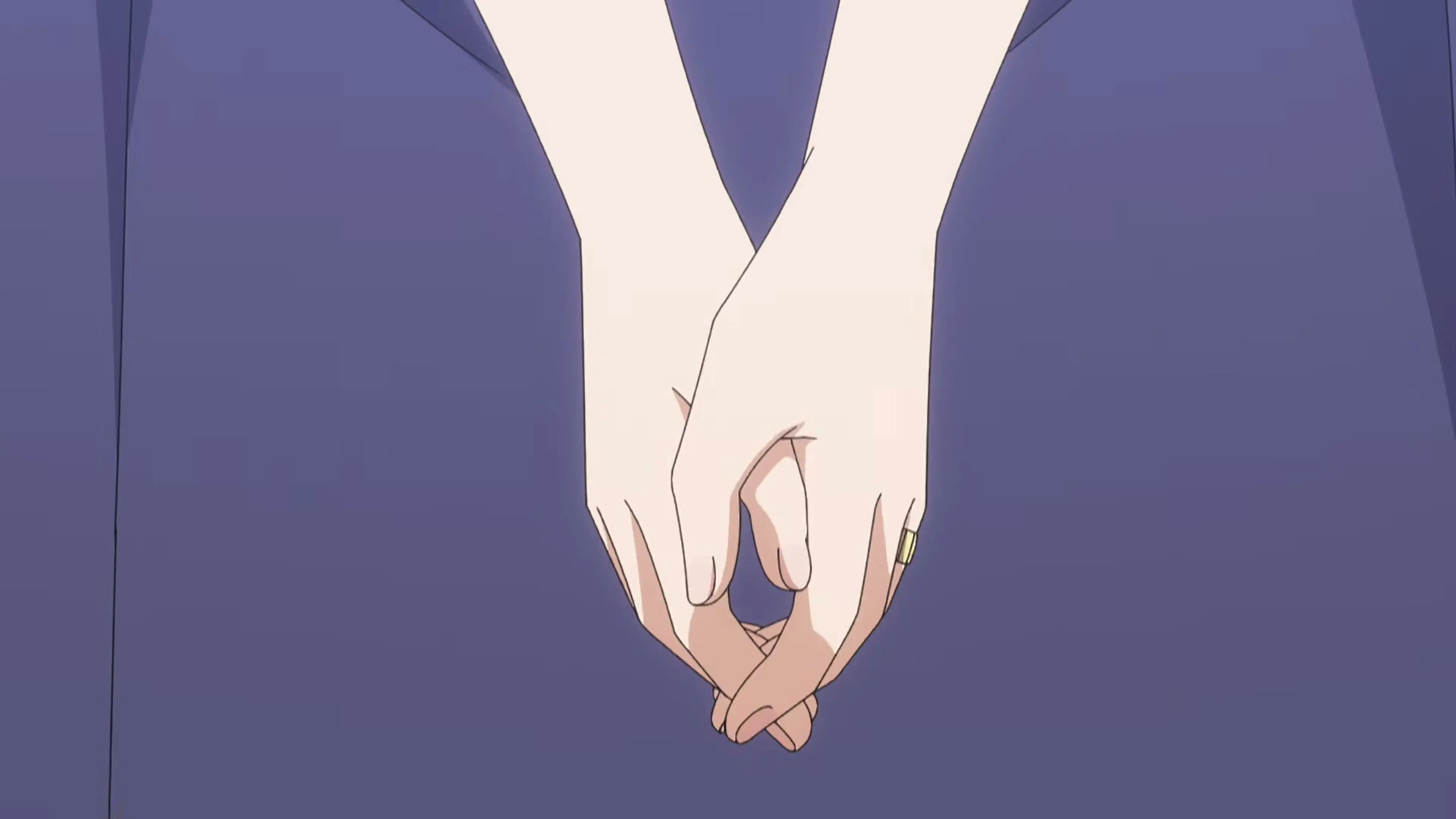 Two hands wearing the Yozakura couple’s matching rings meet against a warm sunset.