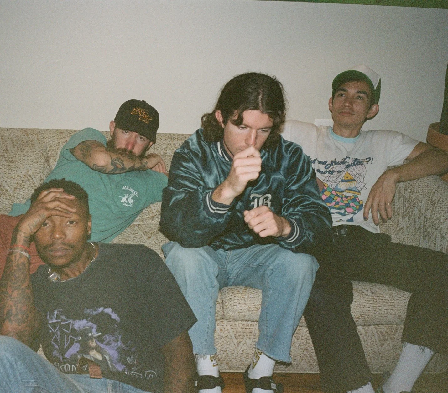 Turnstile members sit together in an archival 2022 press portrait.