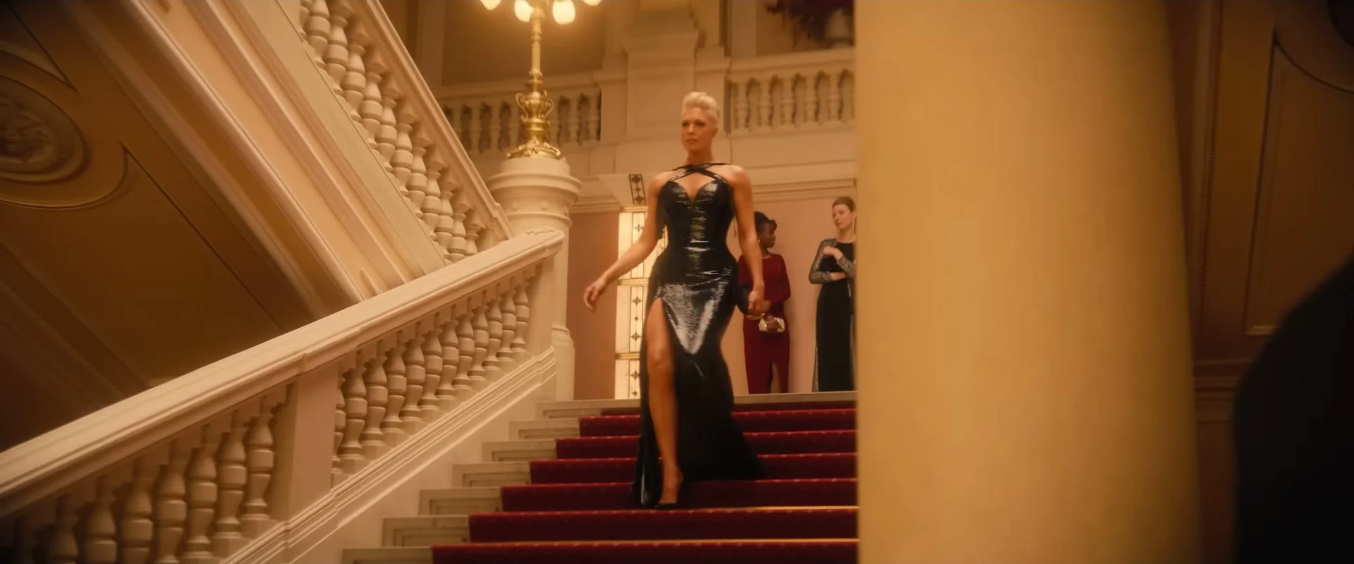 Hannah Waddingham descends a grand staircase as Judith in Ride or Die.