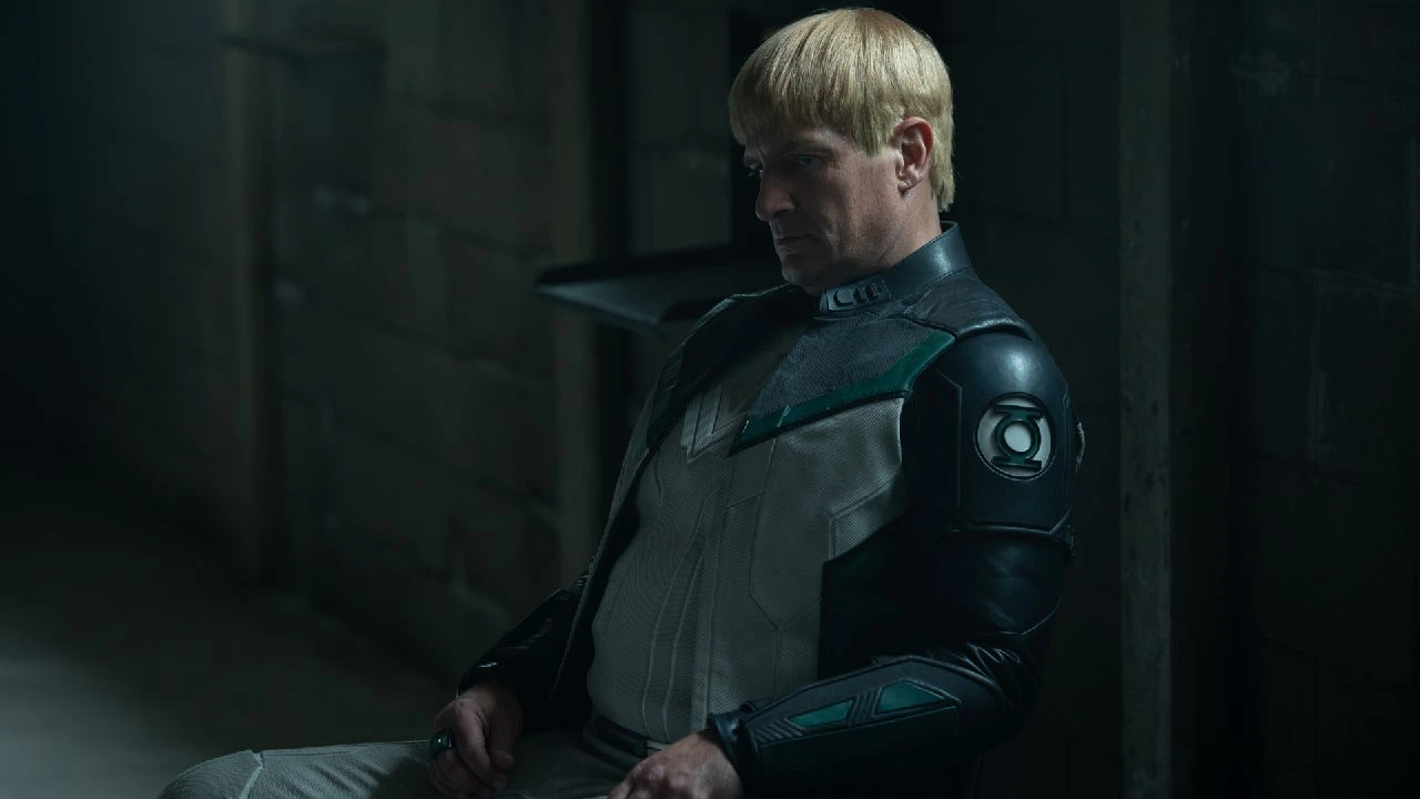 Nathan Fillion as Guy Gardner stands inside a diner in Lanterns.