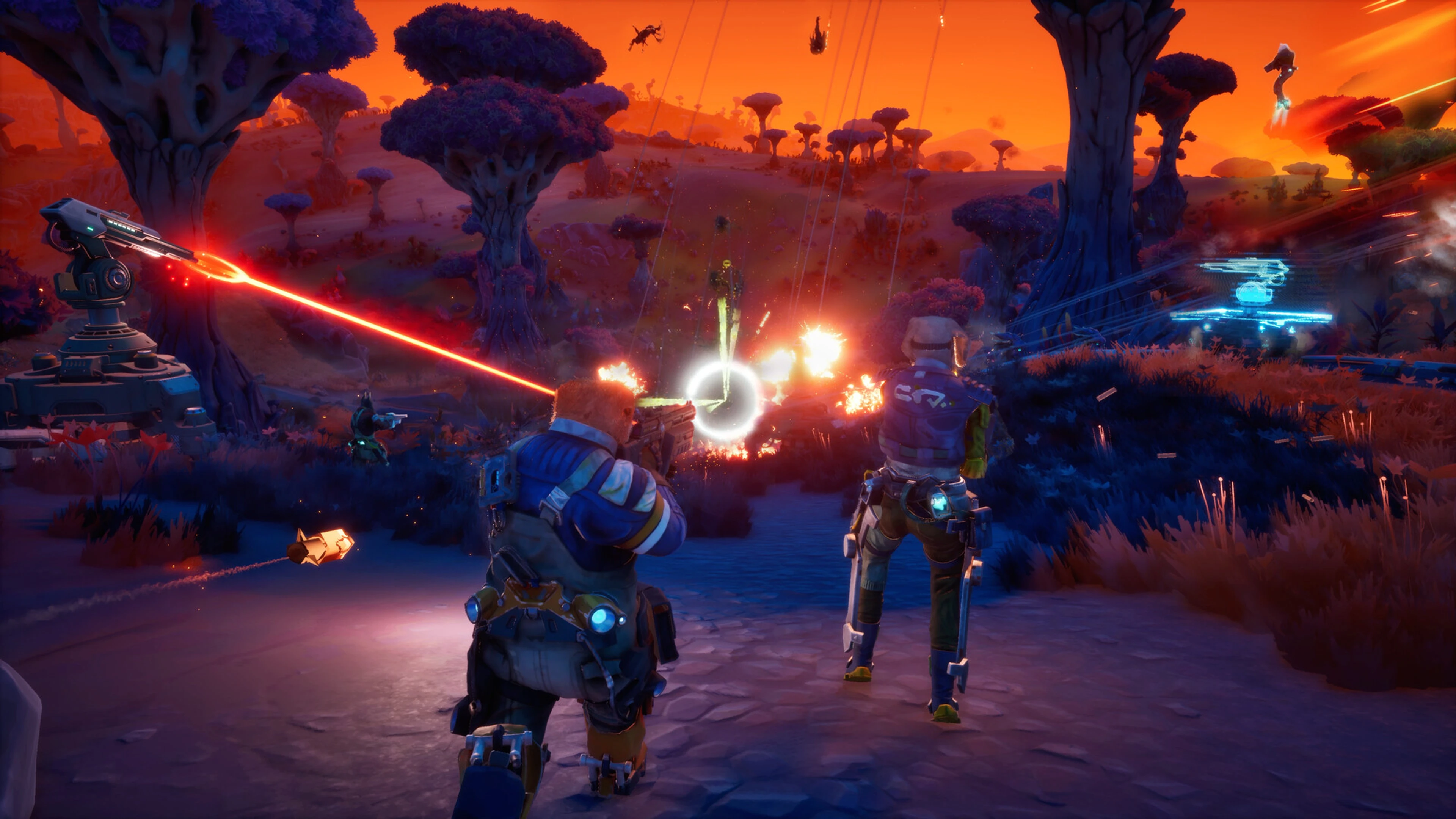 Two Gravhounds defend their base with turrets during an alien swarm attack.