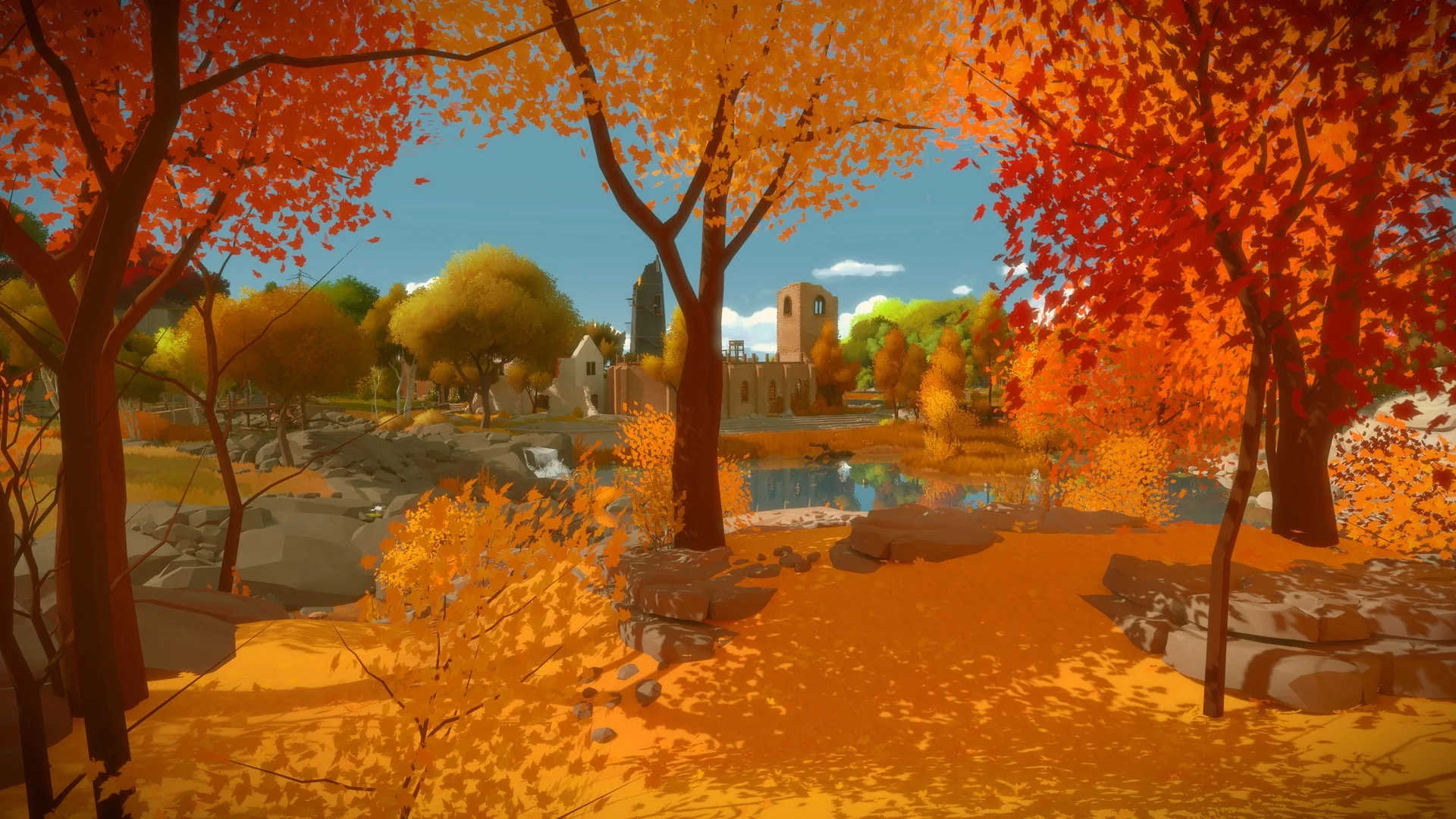 Orange trees surround stone paths and ruins on the open island in The Witness.