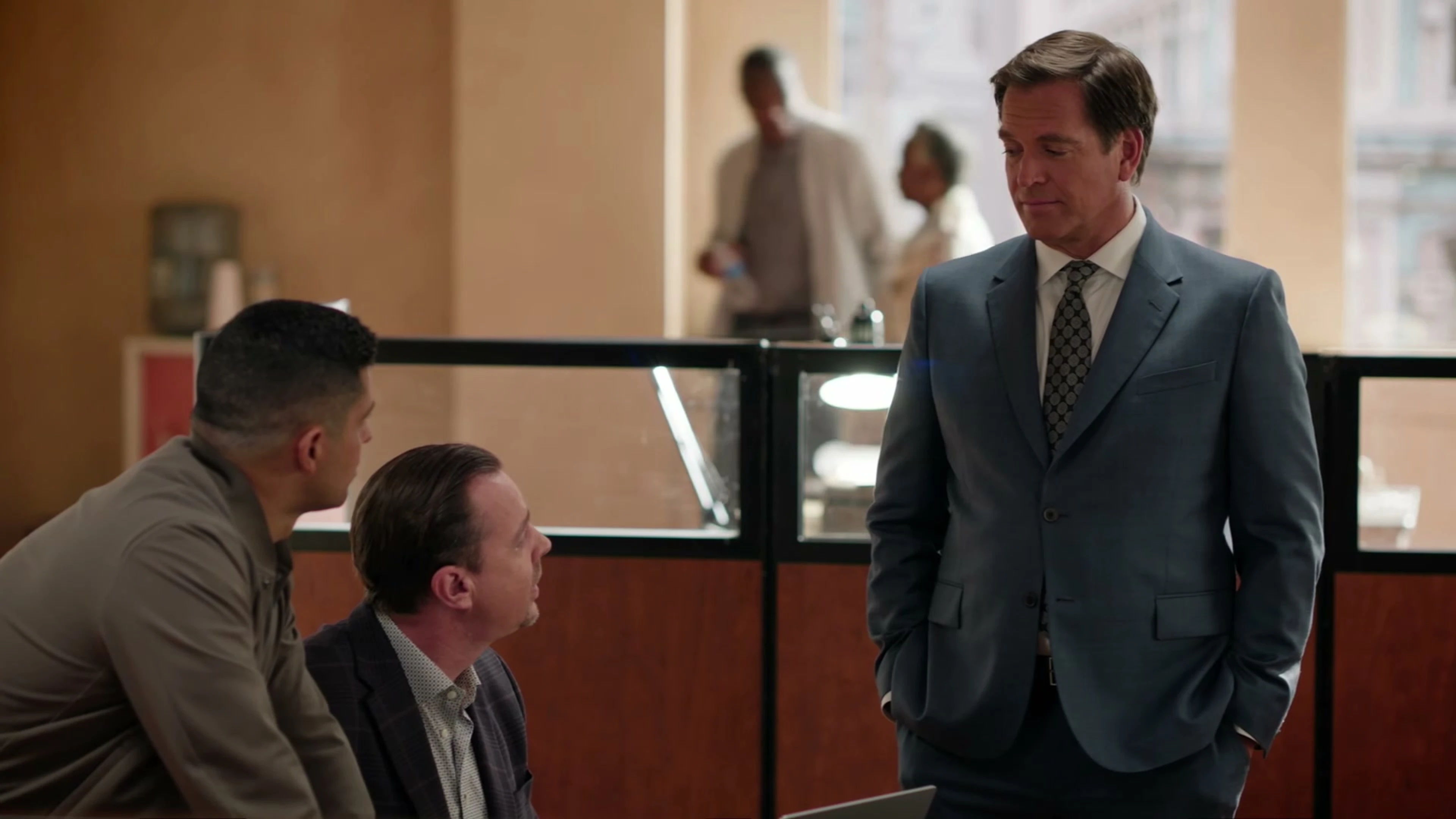 Michael Weatherly as Tony DiNozzo stands beside Wilmer Valderrama as Nick Torres and Sean Murray as Tim McGee in NCIS Season 24.