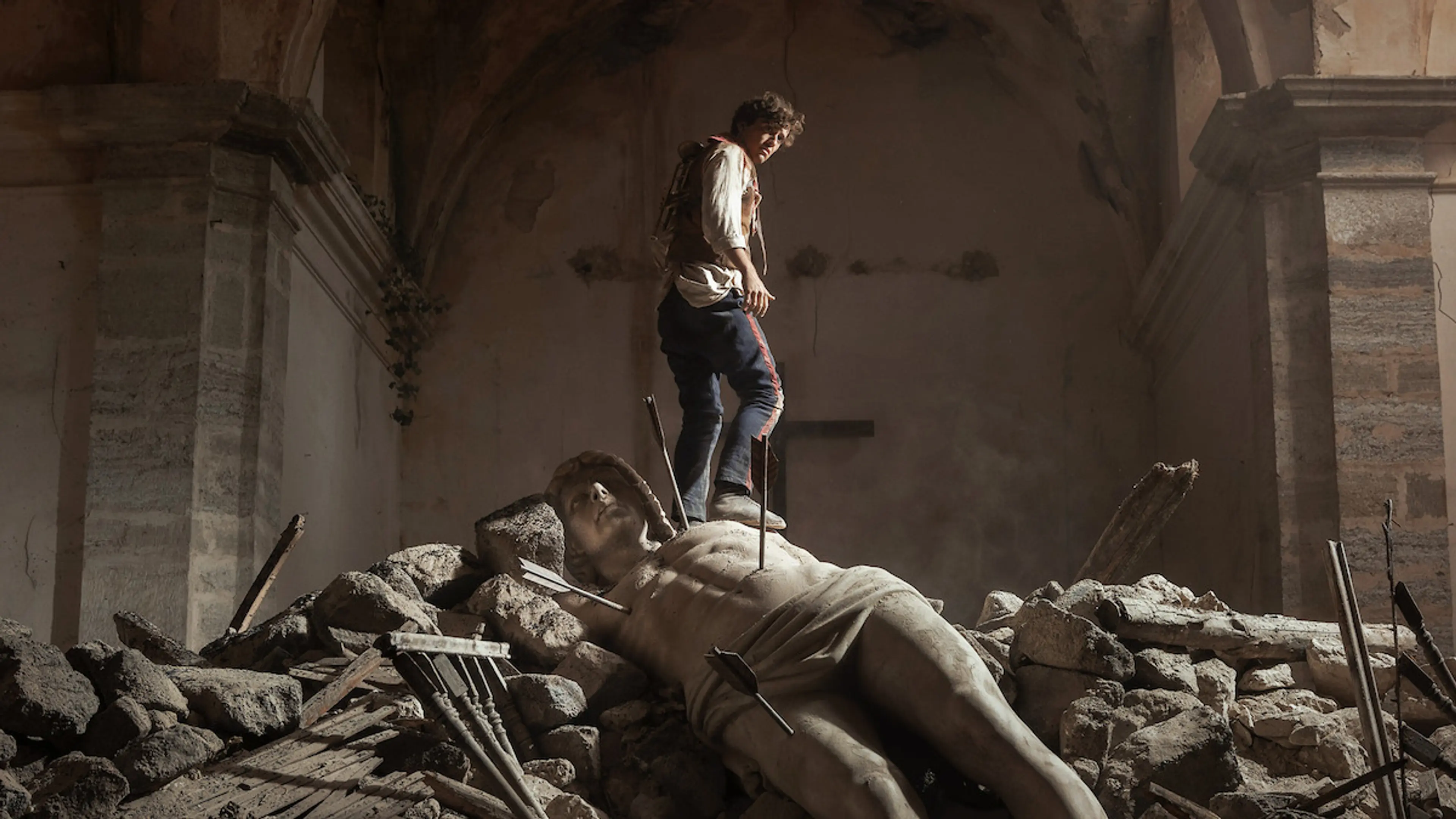 A man stands amid rubble in La Bola Negra.