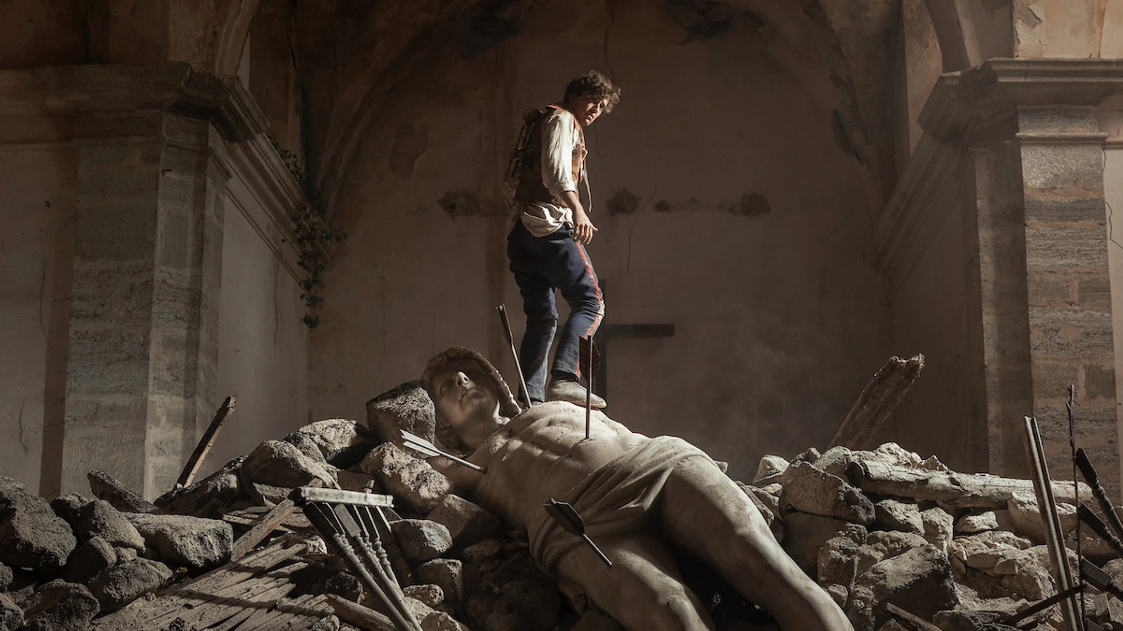 A man stands amid rubble in La Bola Negra.