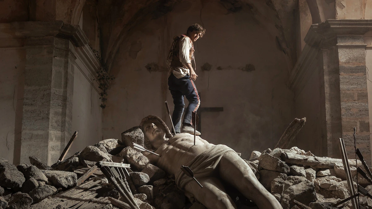 A man stands amid rubble in La Bola Negra.
