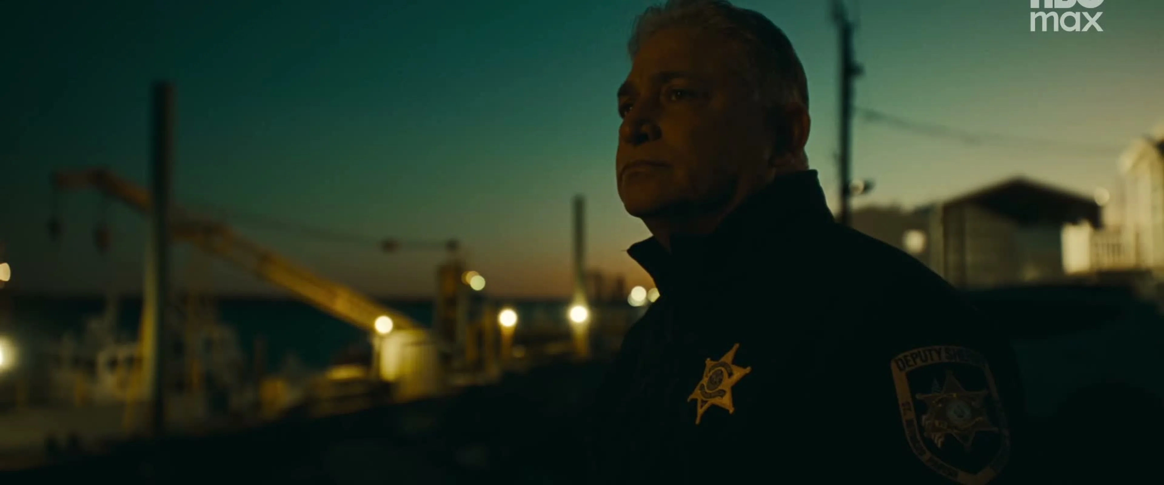 A uniformed officer appears in the trailer.