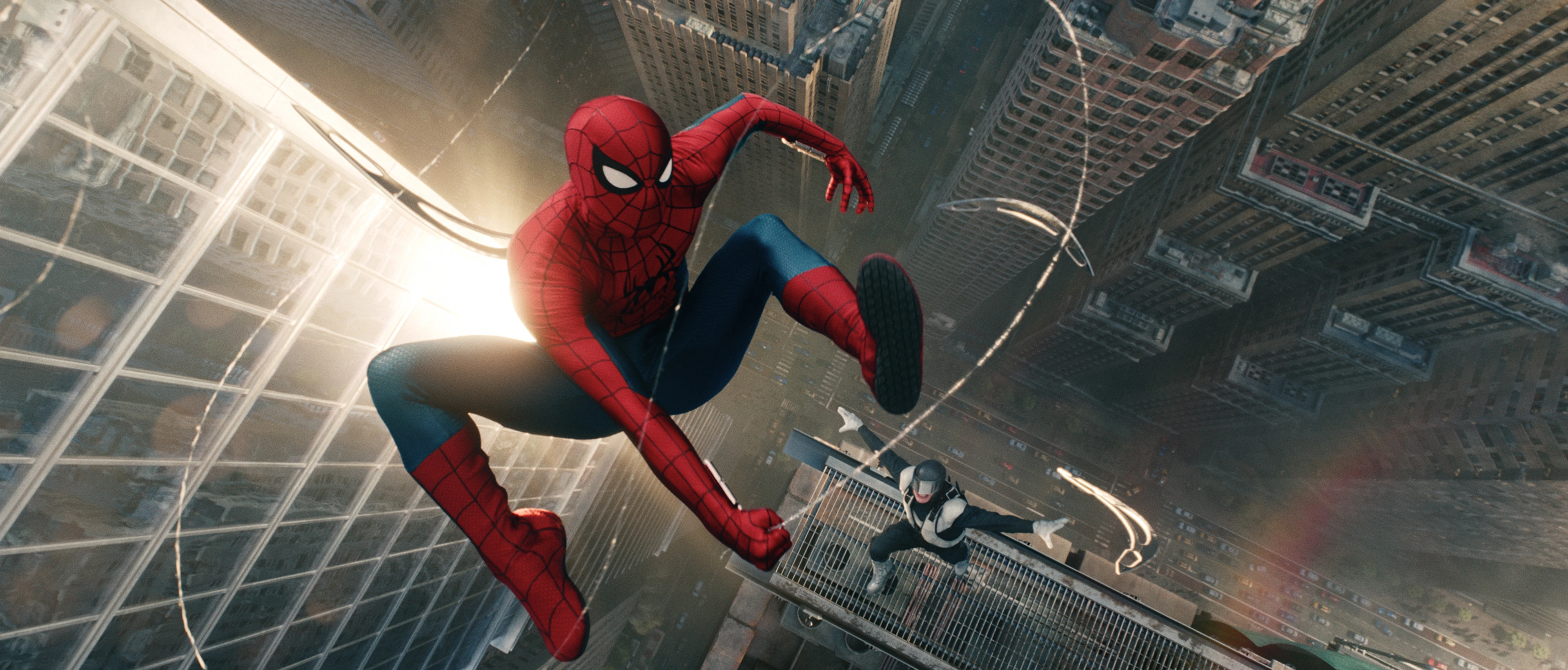 Spider-Man swings between New York buildings in Spider-Man: Brand New Day.