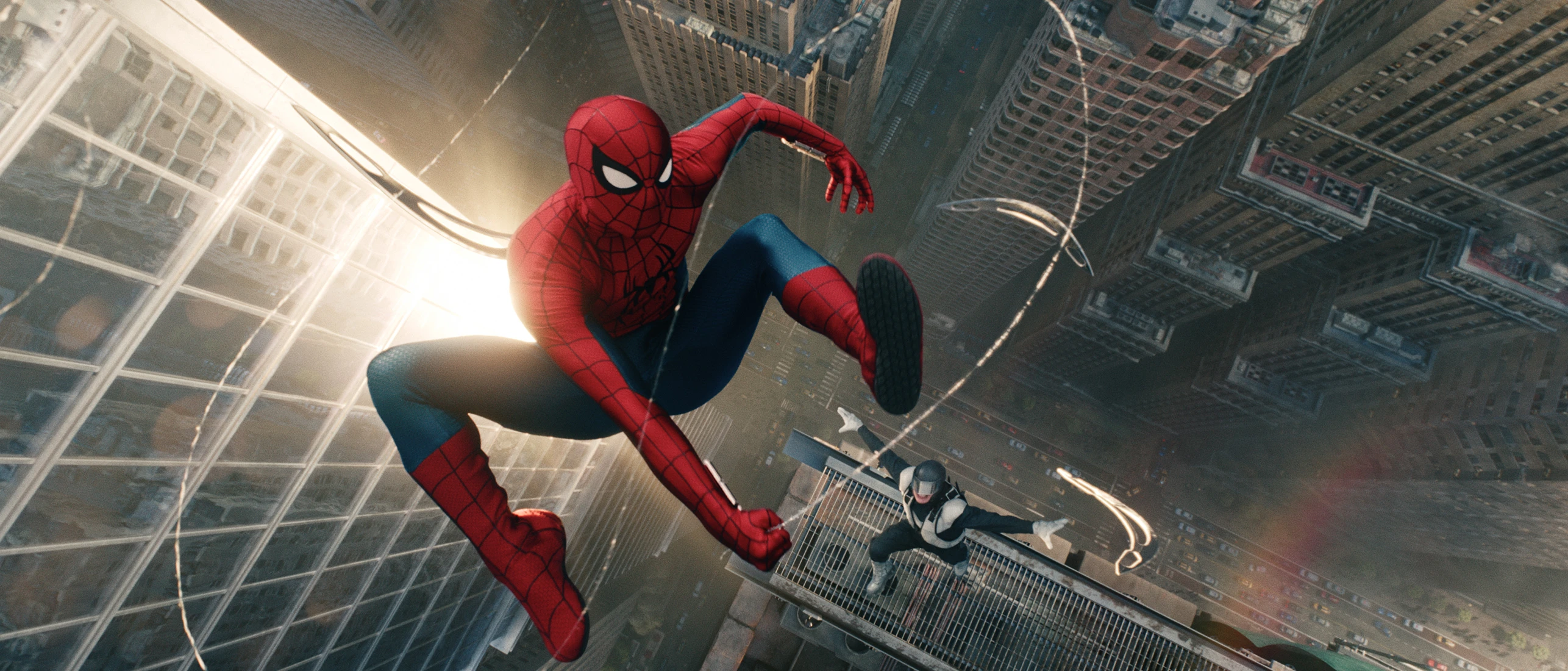 Spider-Man swings between New York buildings in Spider-Man: Brand New Day.