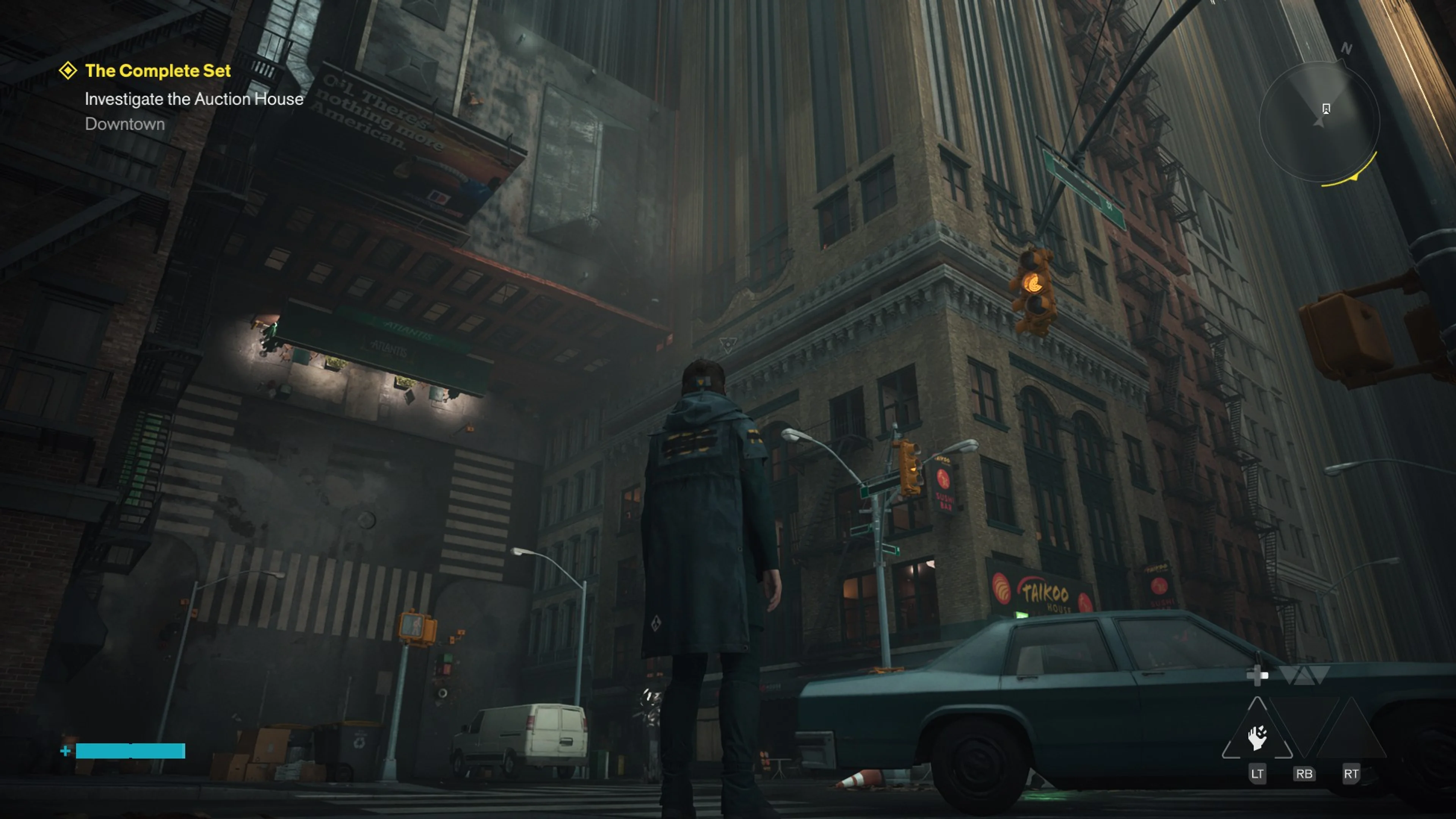 Dylan stands beside a car beneath a street that rises vertically between Manhattan buildings.
