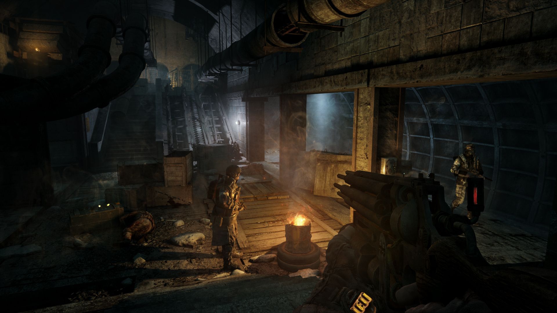 A Ranger stands near a fire in an underground passage in Metro 2033 Redux.