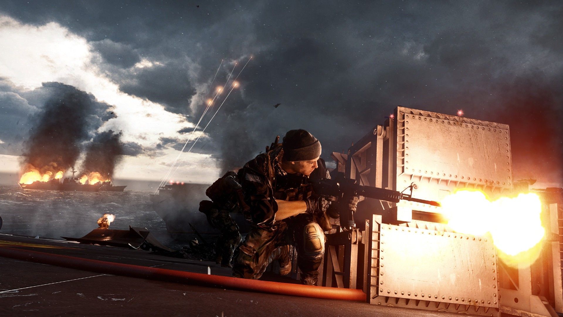 Soldiers fire from cover during a smoky firefight.