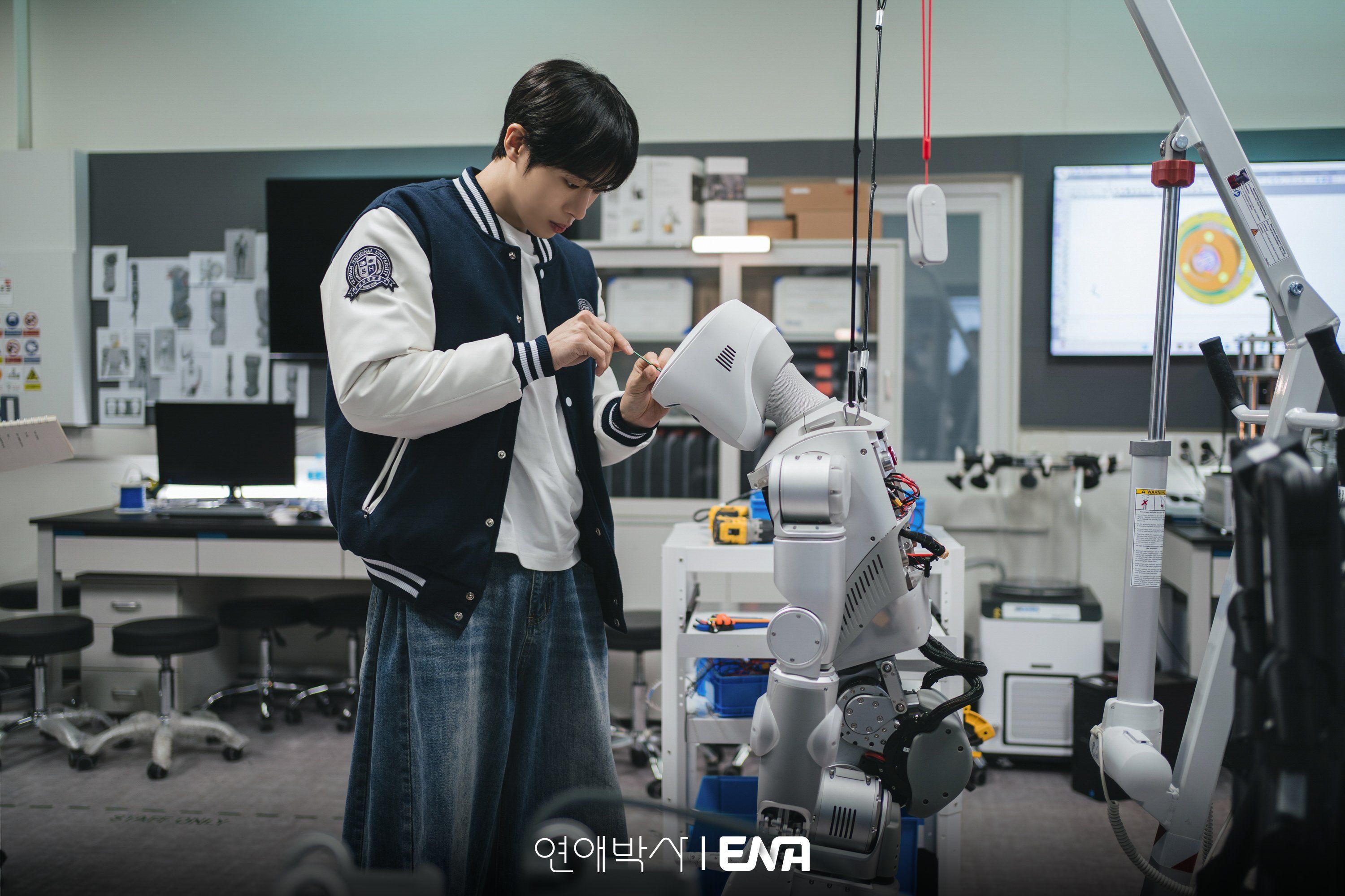 Park Min-jae works on a robot in a university laboratory.