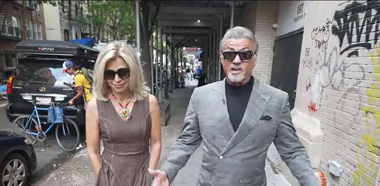 Sylvester Stallone walks with correspondent Tracy Smith in New York during the 2026 Sunday Morning profile.