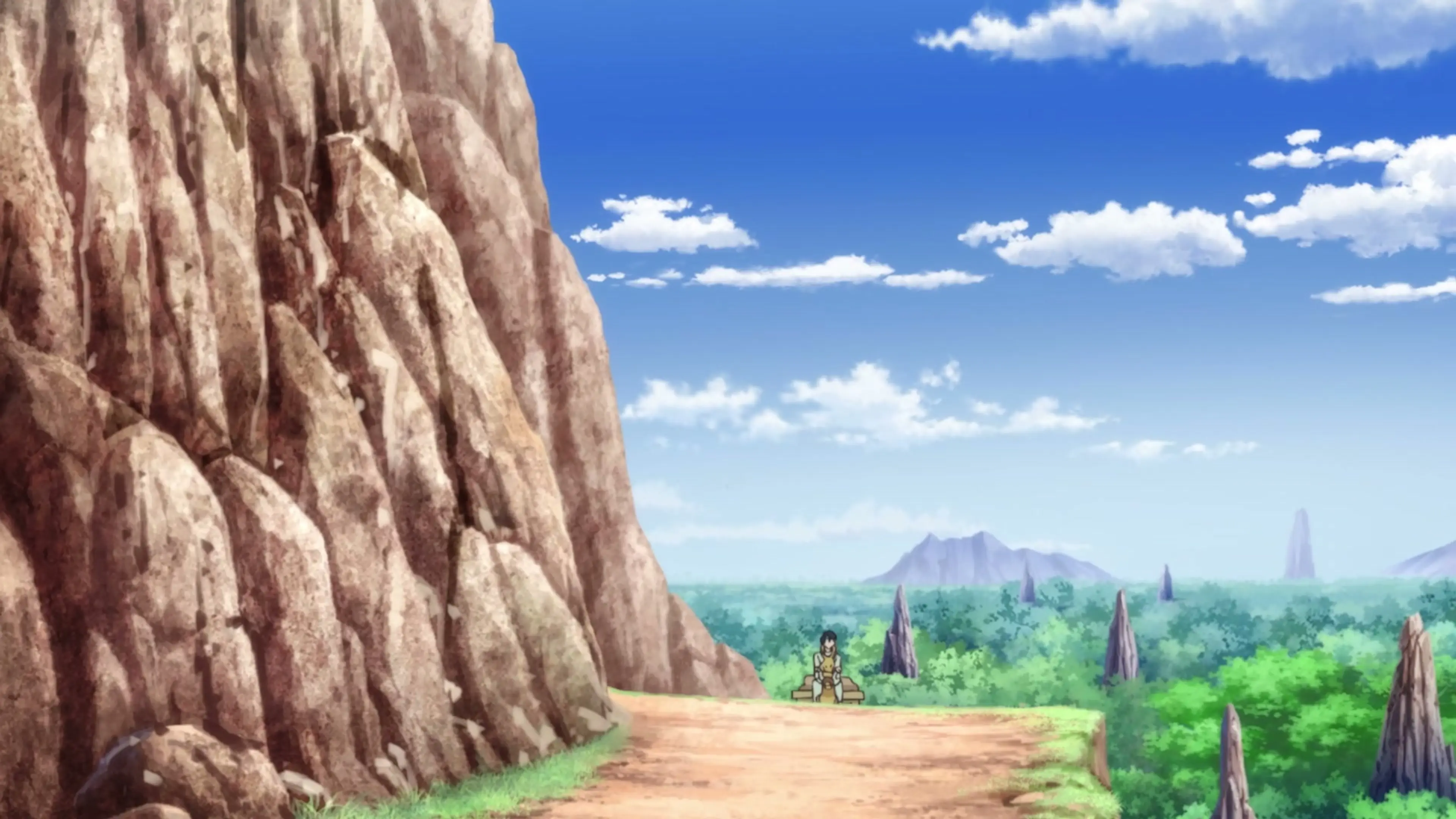 A traveler sits beside a towering rock face overlooking forests and stone spires in From Far Away.
