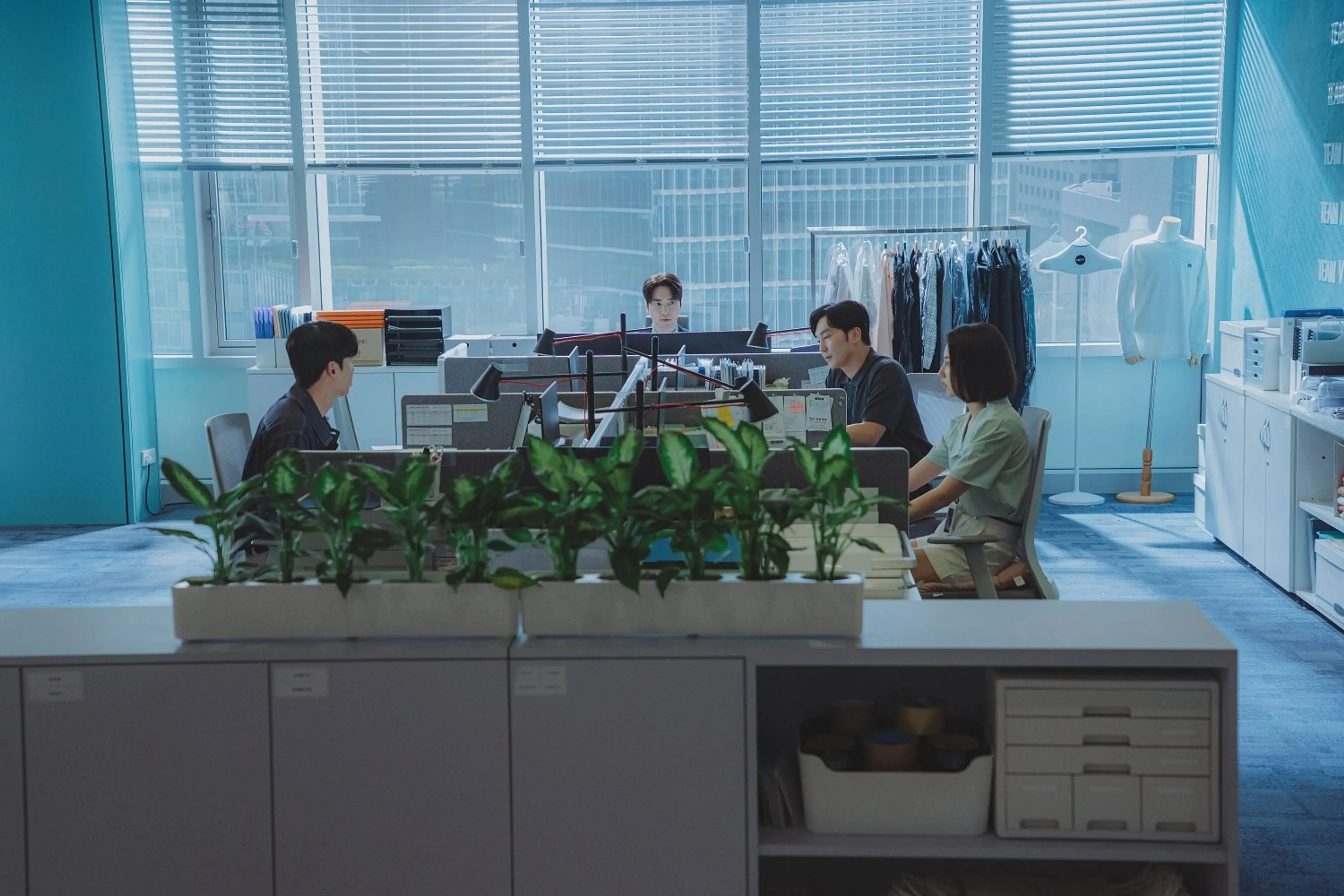 Sales Team 5 gathers in its open-plan office.