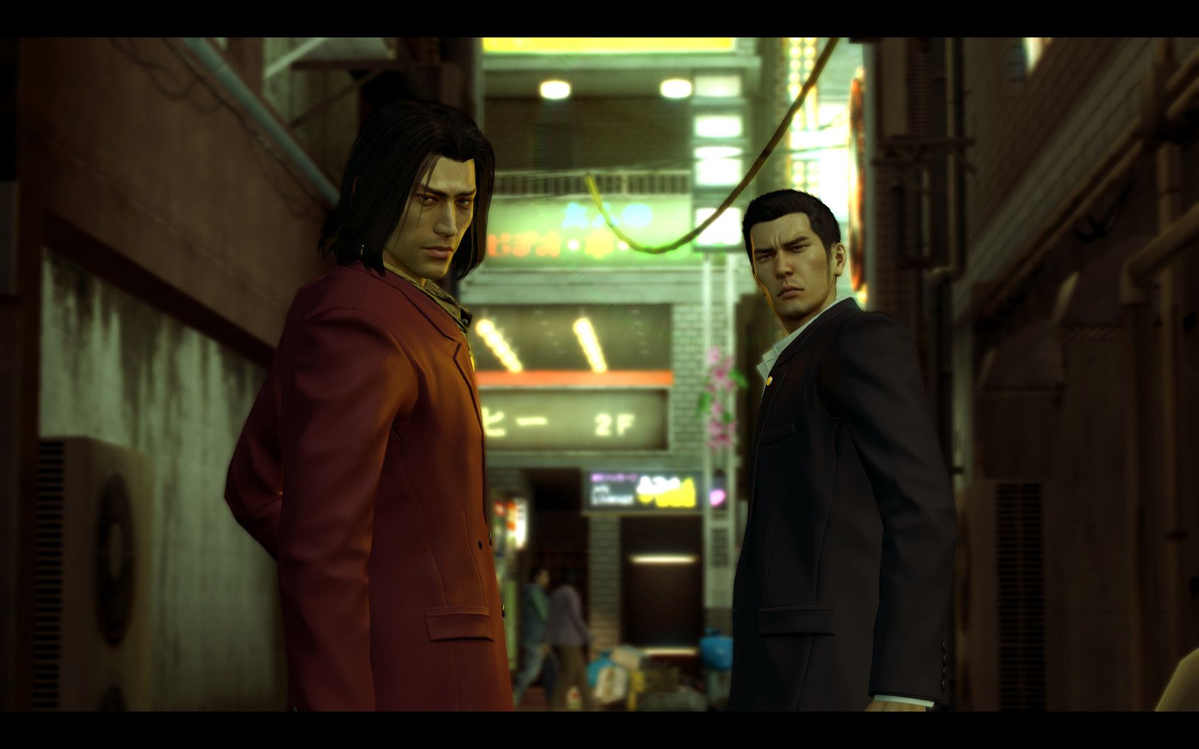 Kiryu and Majima stand together in a narrow city passage.