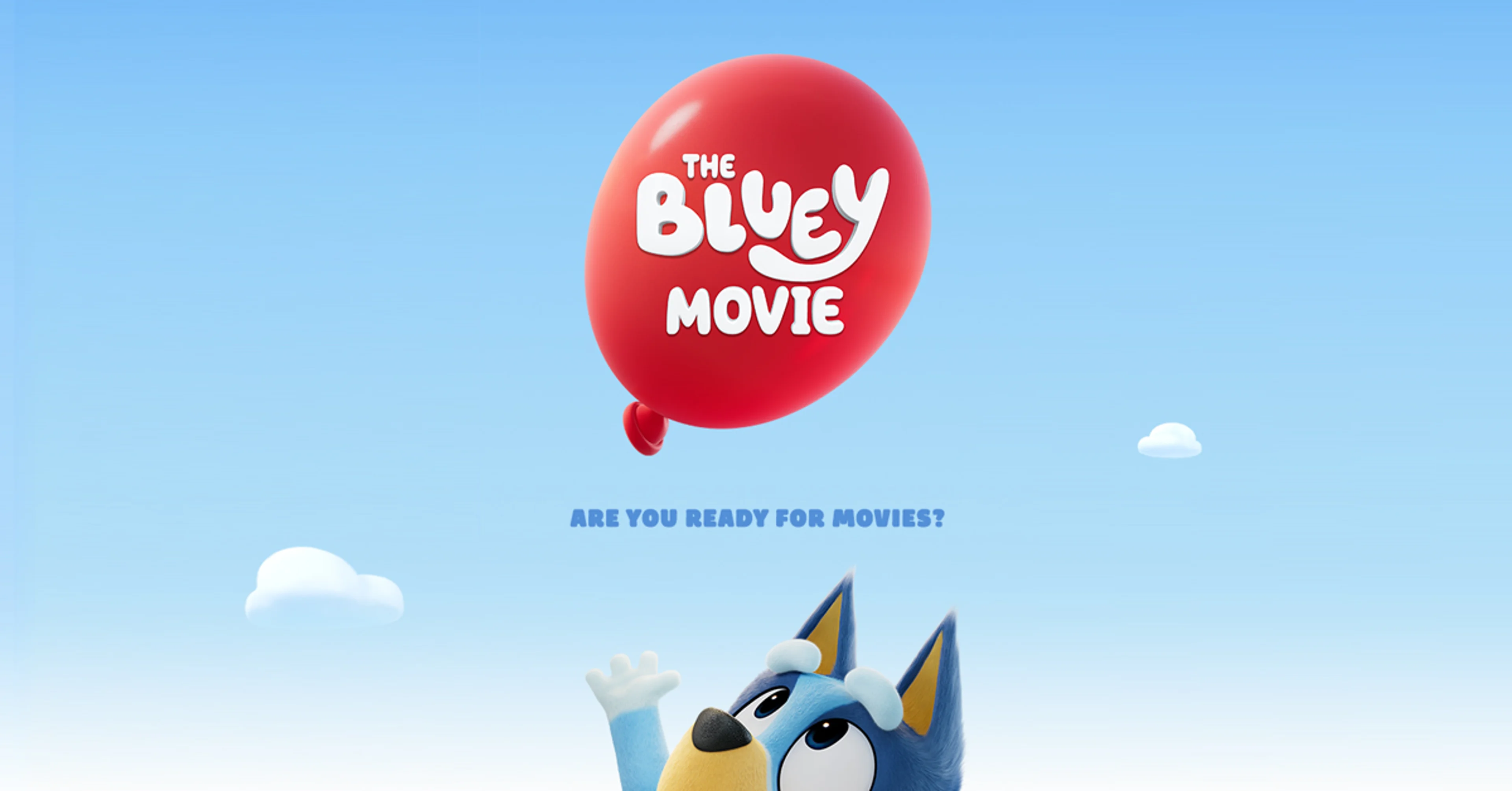 Bluey and Bingo run through a sunny yard in the official teaser image for The Bluey Movie.