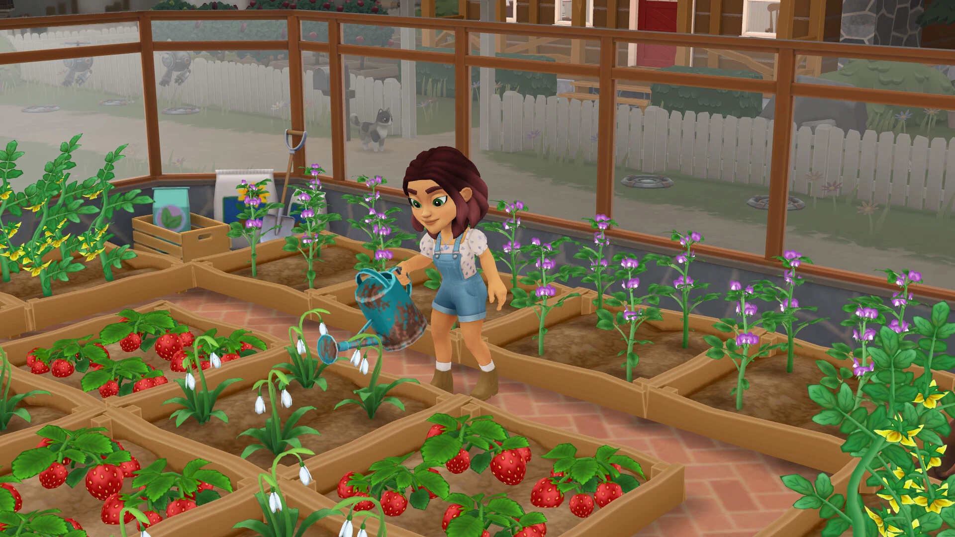 Tara tending plants inside a greenhouse in Wylde Flowers.