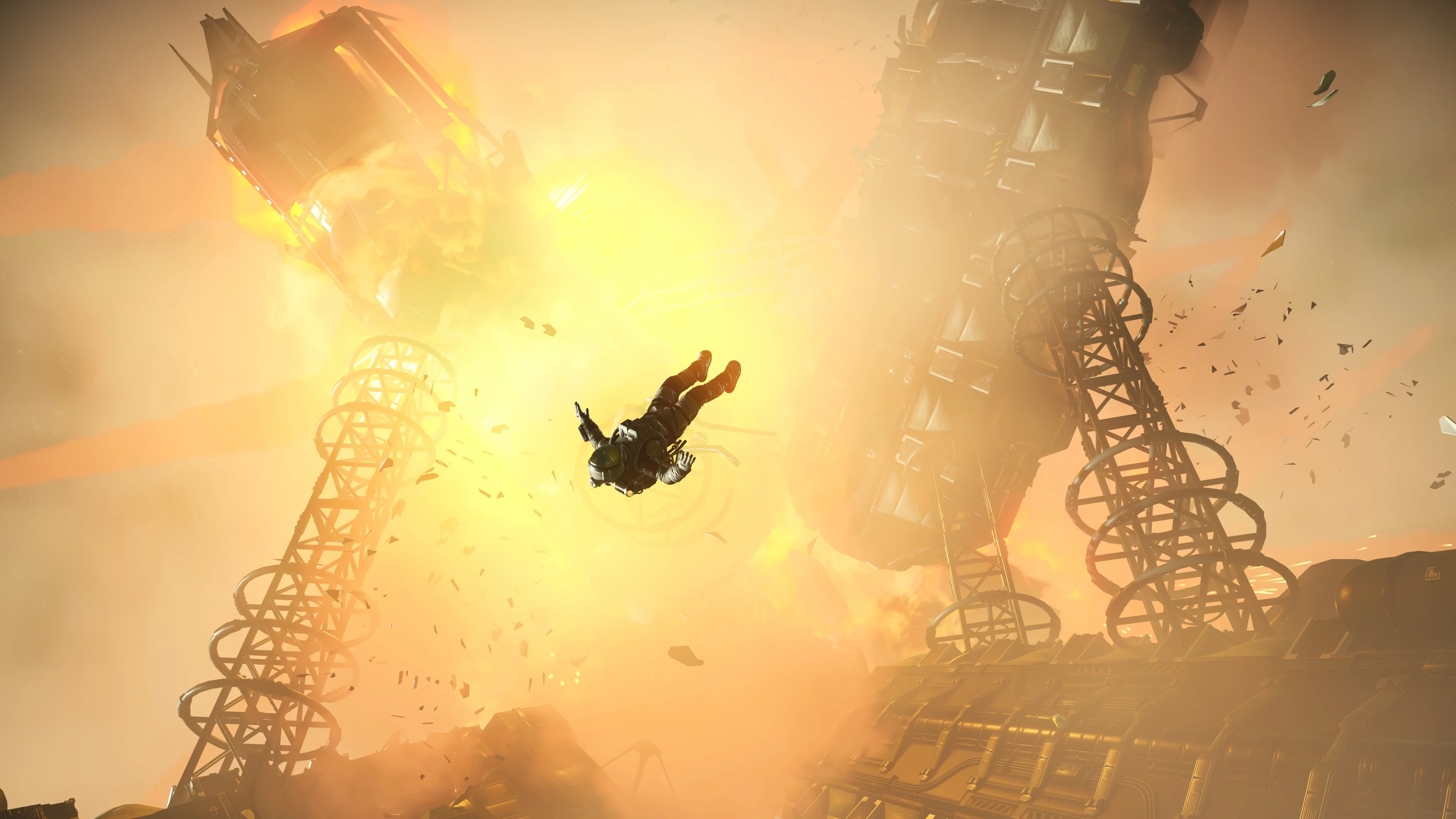 A Traveller spacewalks through orange fire and broken metal as a derelict hulk explodes in No Man’s Sky Cosmos.