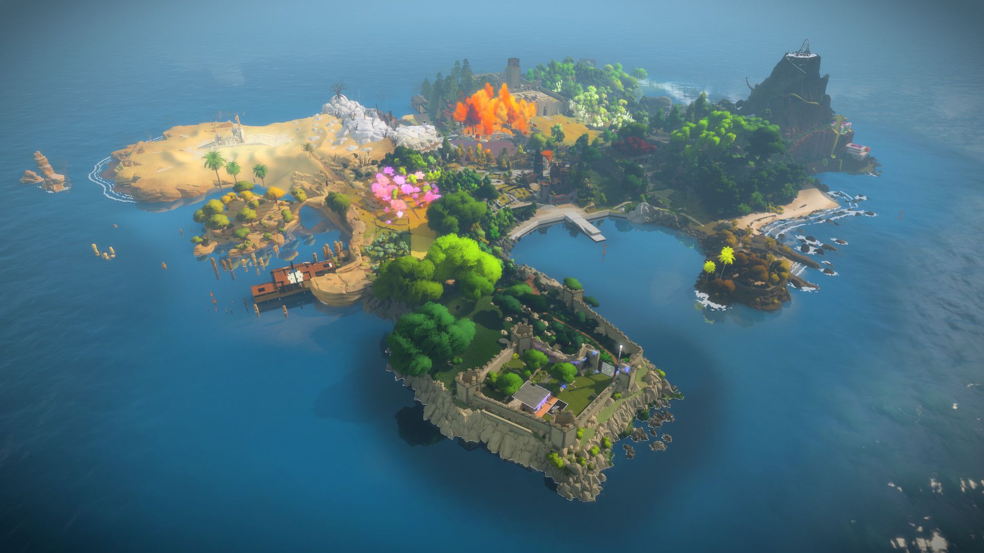 A wide overhead view reveals the island, water, gardens and buildings.