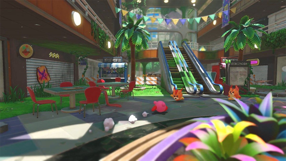Kirby explores a brightly lit abandoned shopping mall.