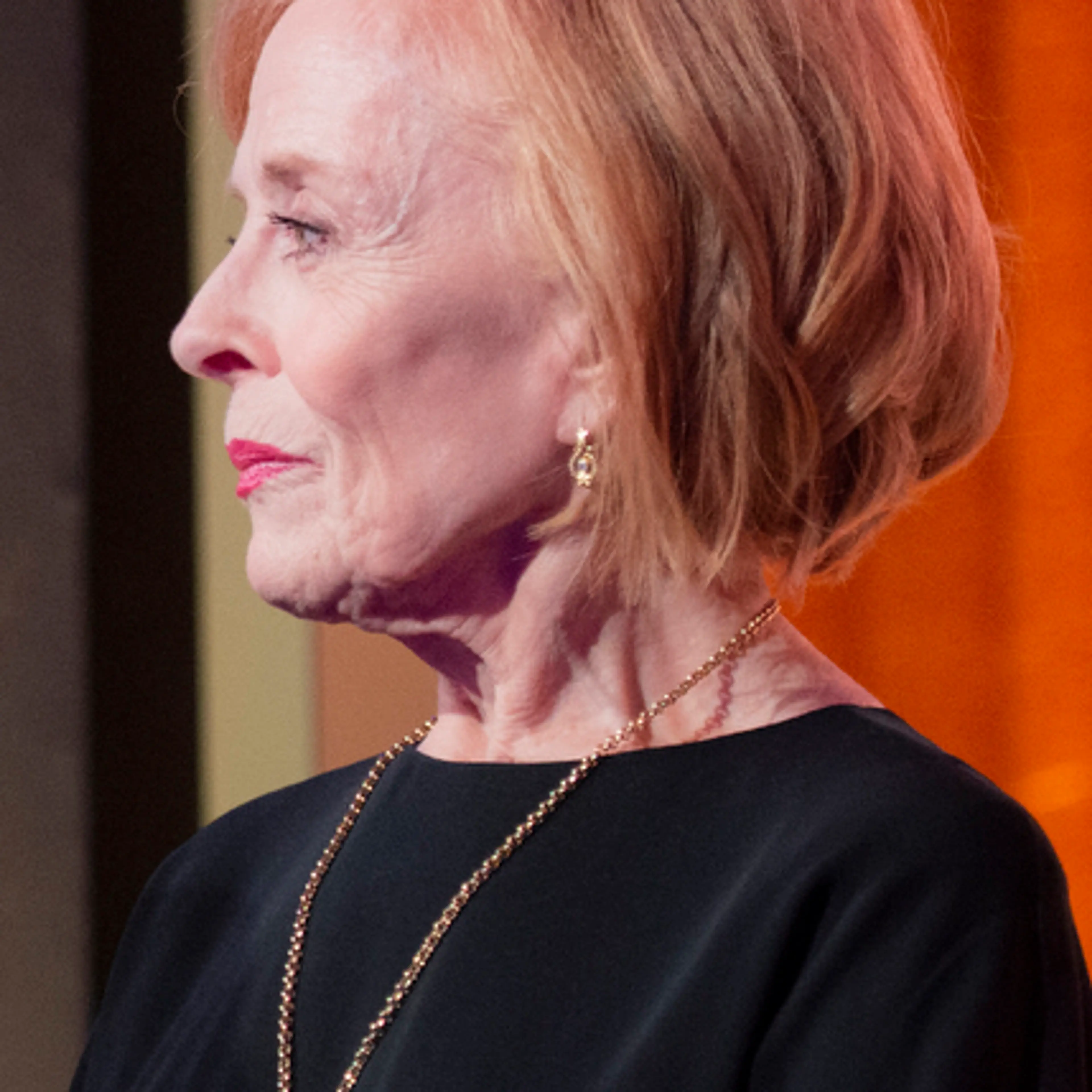 Holland Taylor in profile wearing a black top and gold necklace at a 2020 tribute.