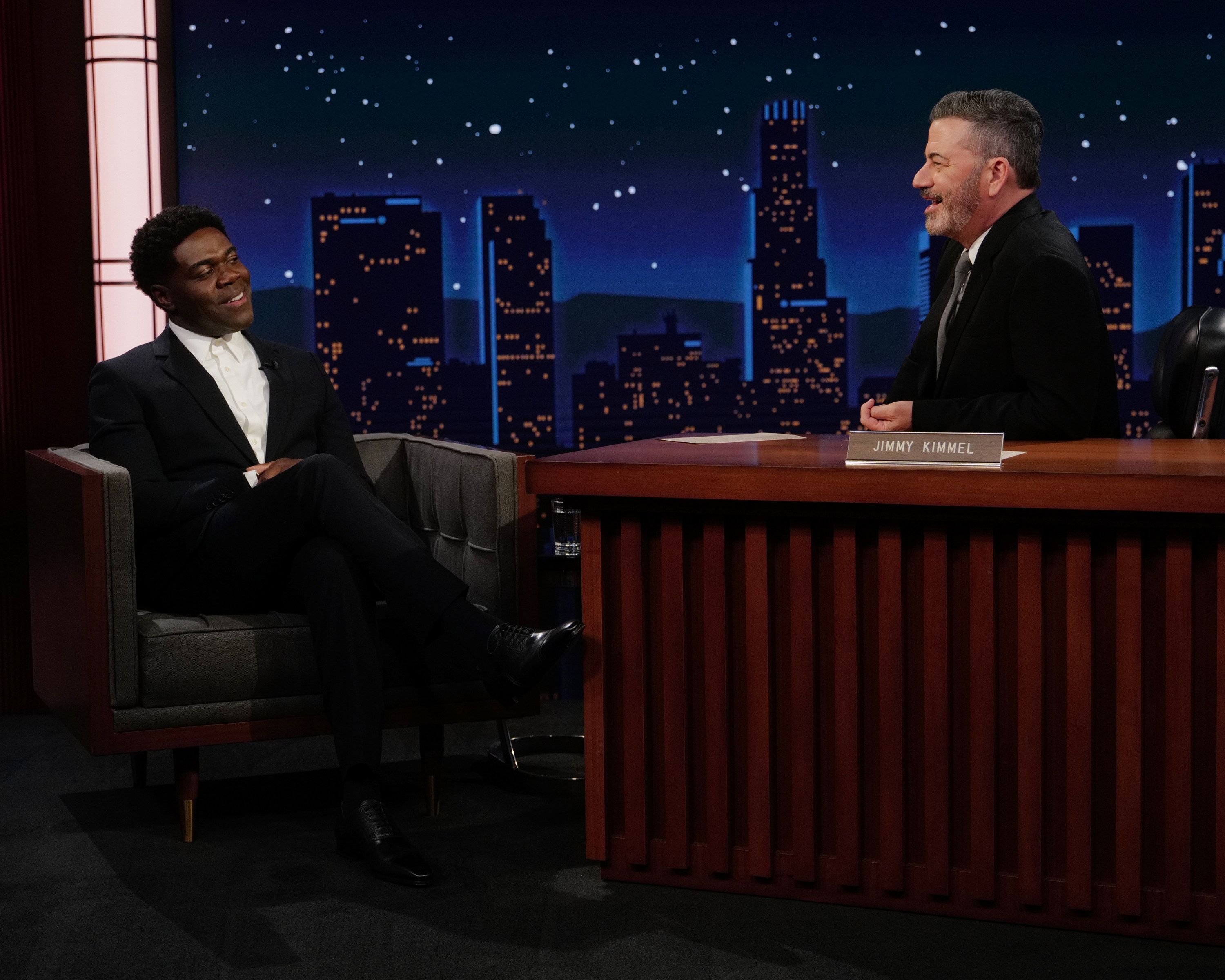 Sam Richardson speaks with Jimmy Kimmel during a studio interview.