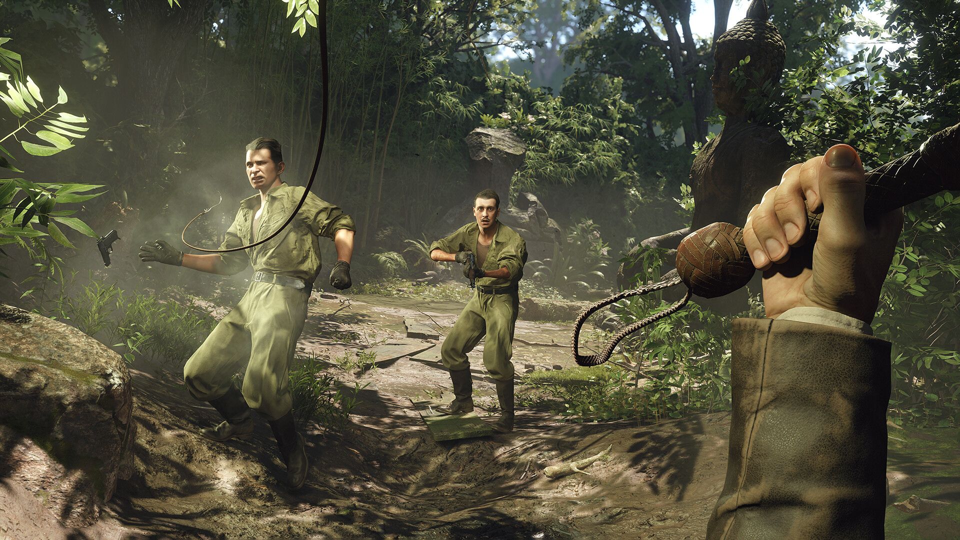 Indiana Jones faces armed enemies with a whip in a forest.