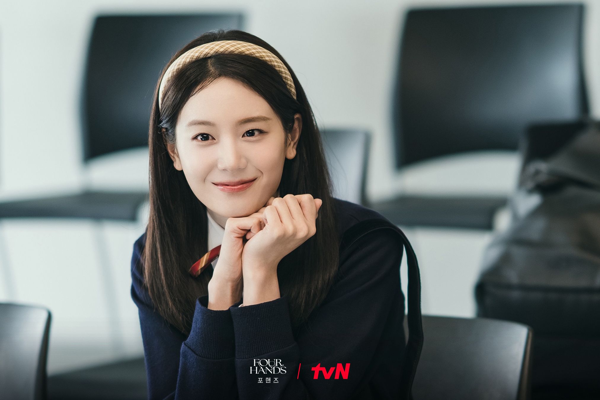 Jang Gyu-ri as Hong Jae-in smiles in a music classroom in Four Hands, Two Sonatas.