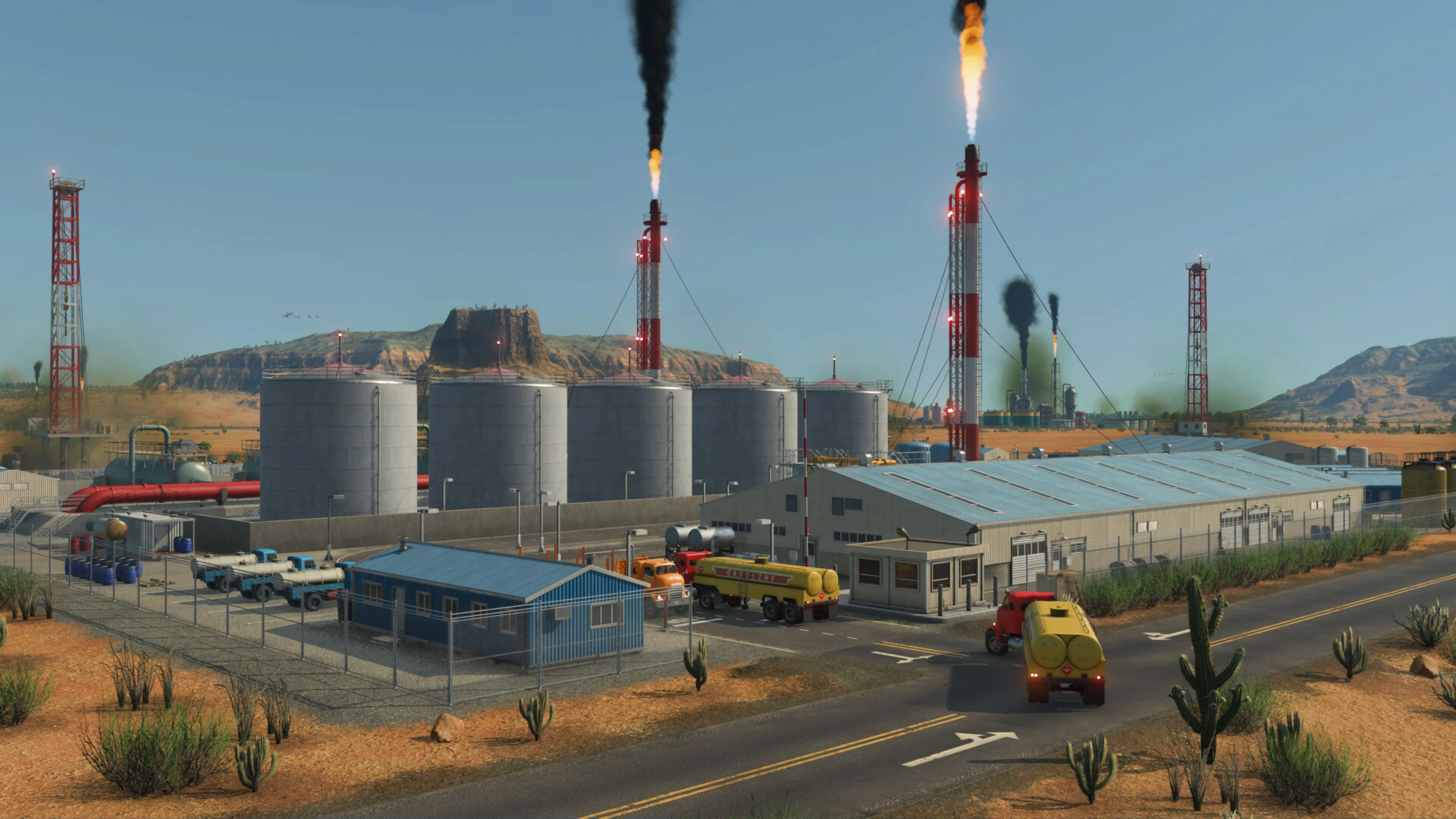 Trucks move through an industrial site in a desert Transport Fever 3 map.
