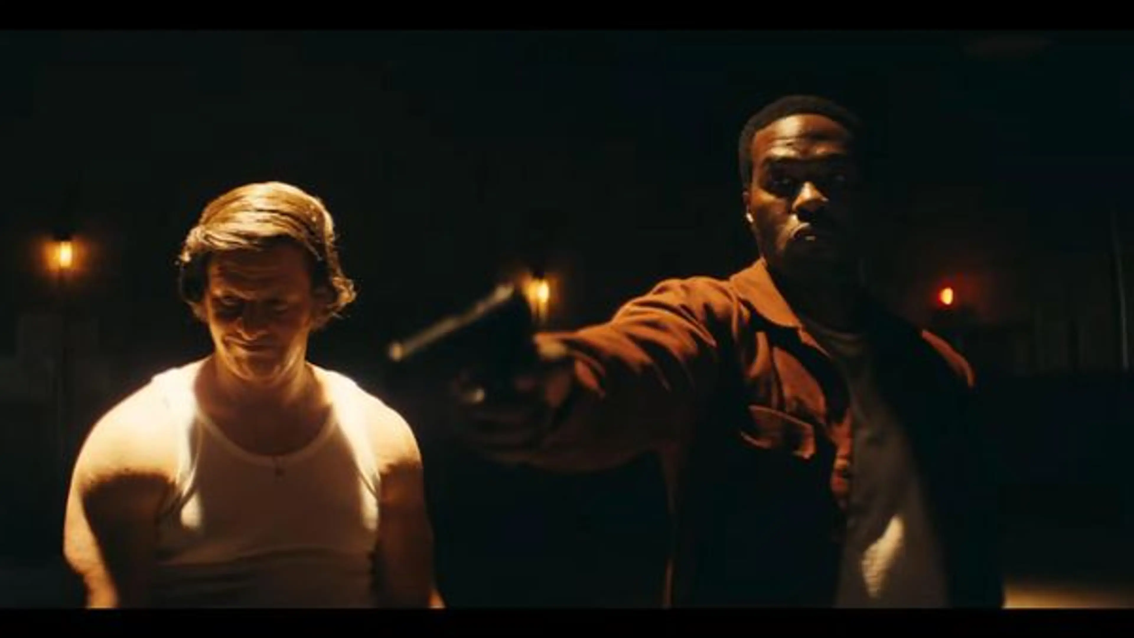 Wayne Strider points a handgun while Greg Scarpa looks down during an interrogation in By Any Means.