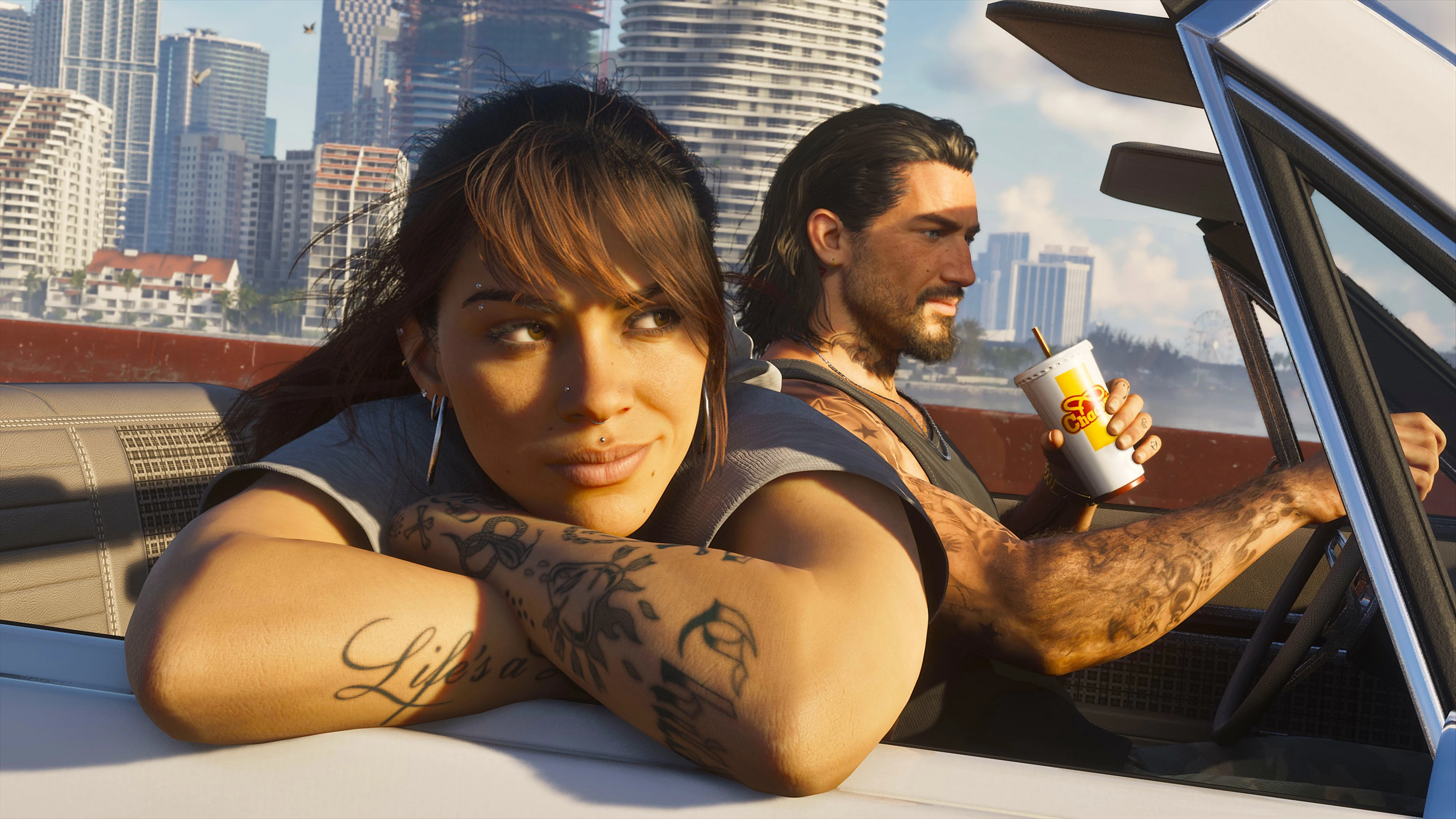 Jason and Lucia stand together during an official Grand Theft Auto VI robbery scene.