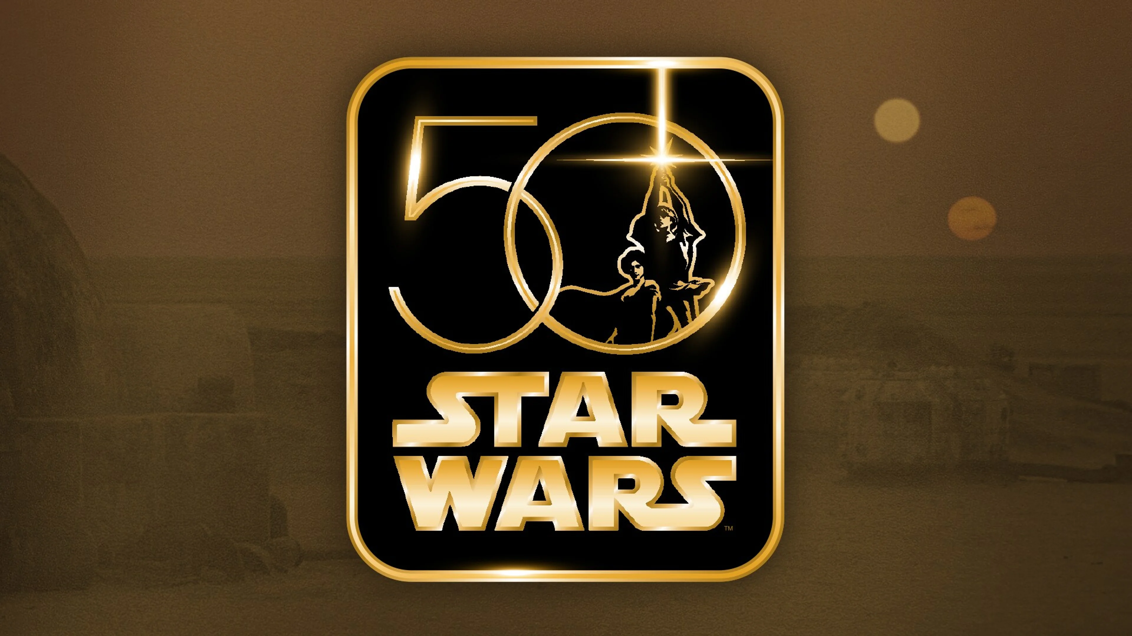 A gold Star Wars 50th anniversary logo appears over a desert landscape.