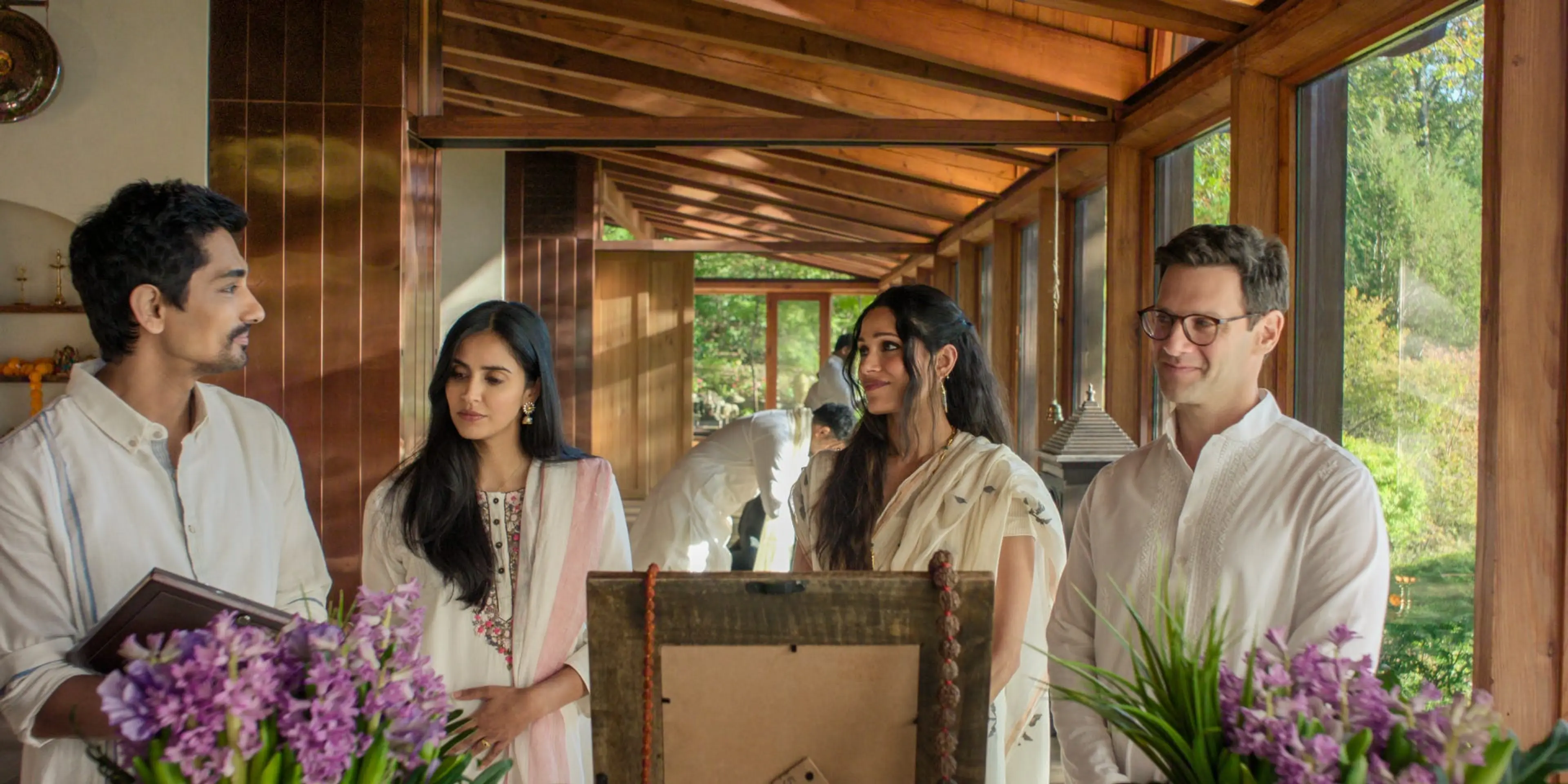 Siddharth, Parveen Kaur, Freida Pinto and Justin Bartha gather in a bright room in Unaccustomed Earth.