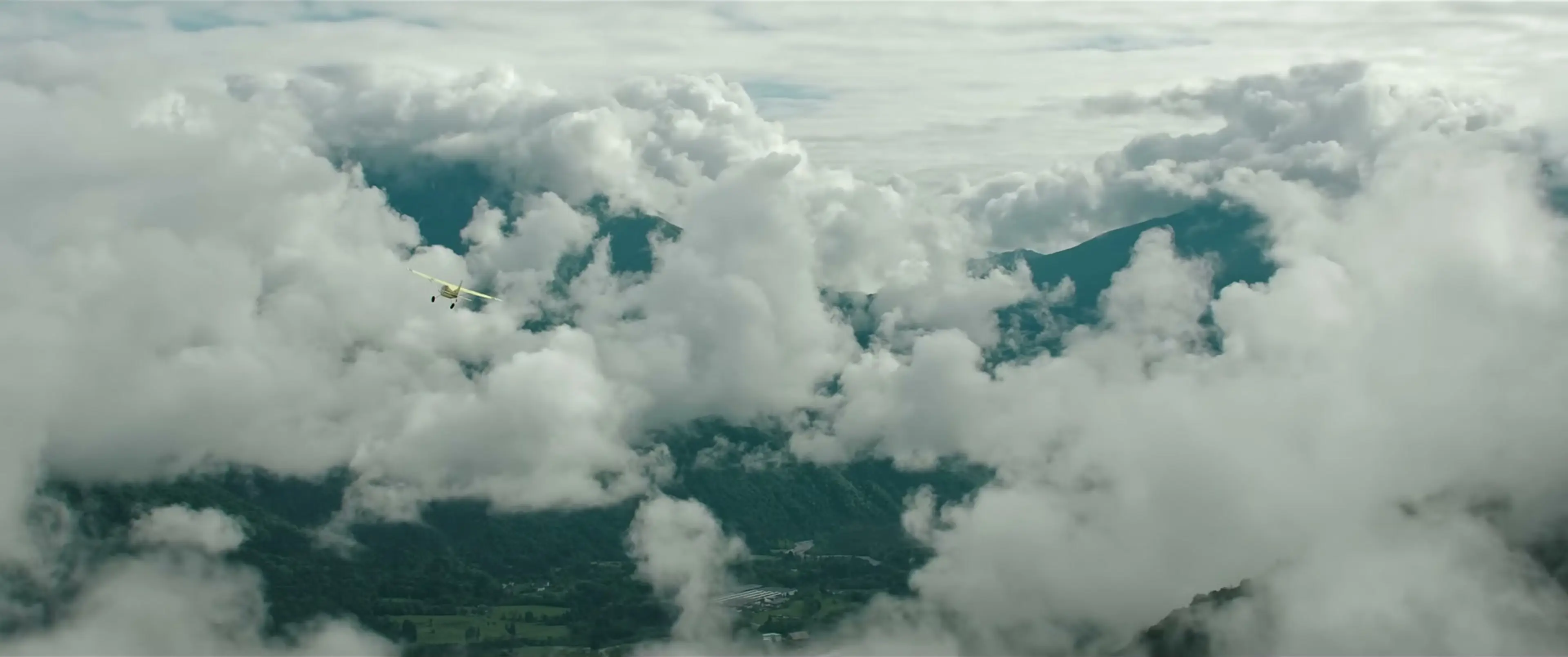 Hig’s yellow Cessna flies between clouds and mountain peaks in The Dog Stars.