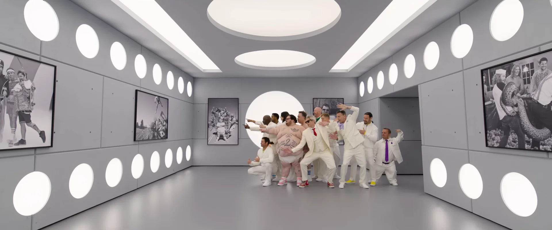 The Jackass: Best and Last cast gathers in a bright white stunt room.