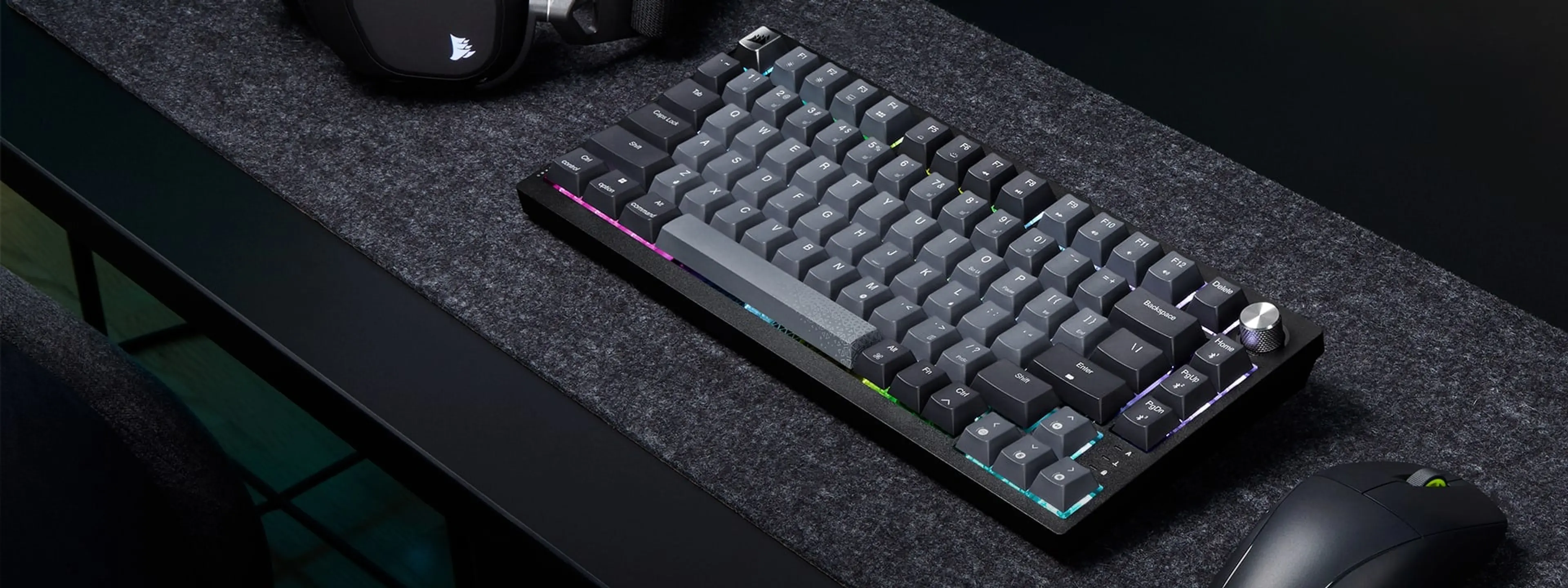 Angled view of the K65 Plus Wireless with colored lighting around its keys