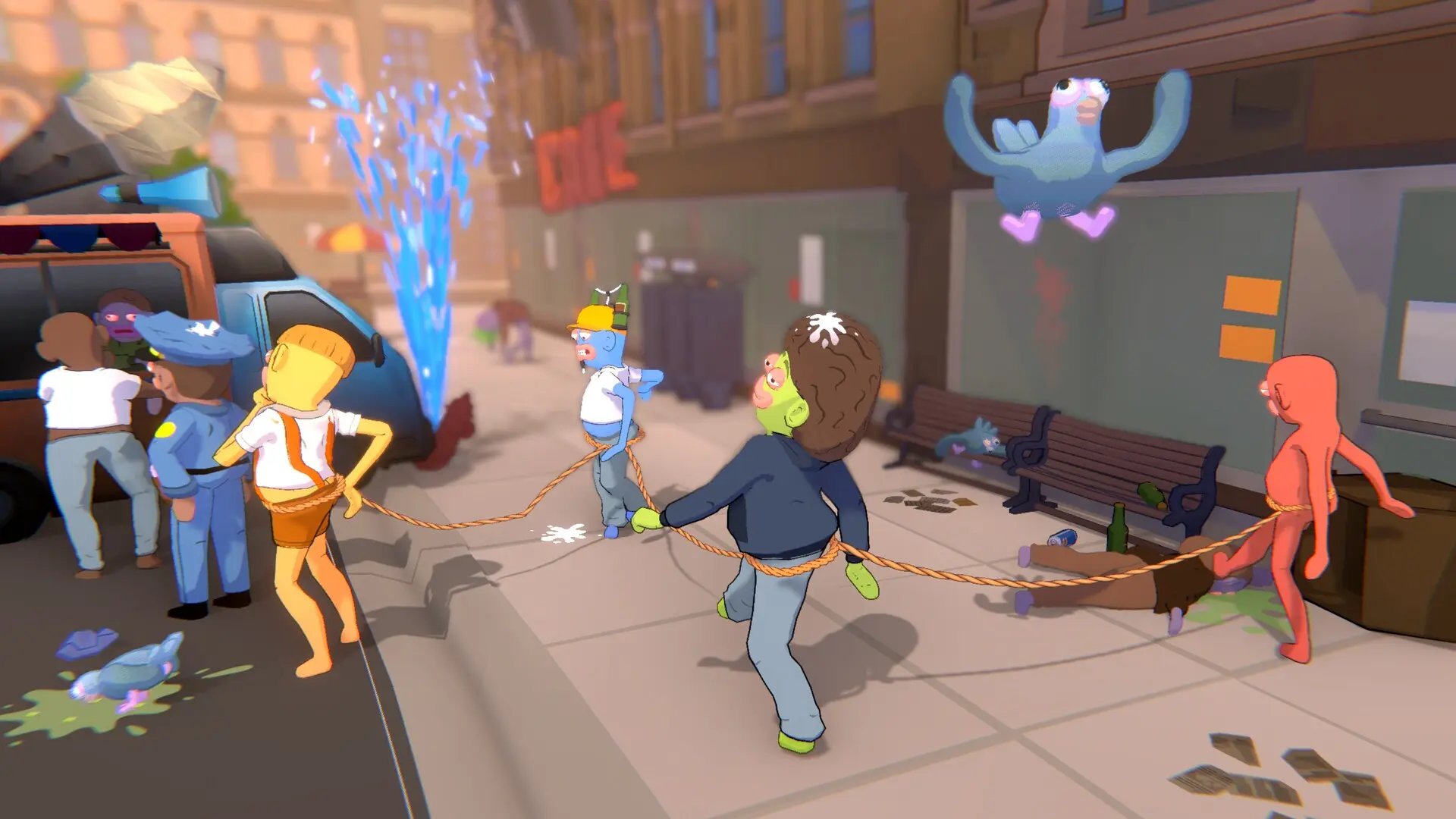 Four Friendly Steps players linked by a rope stumble through a chaotic city street.