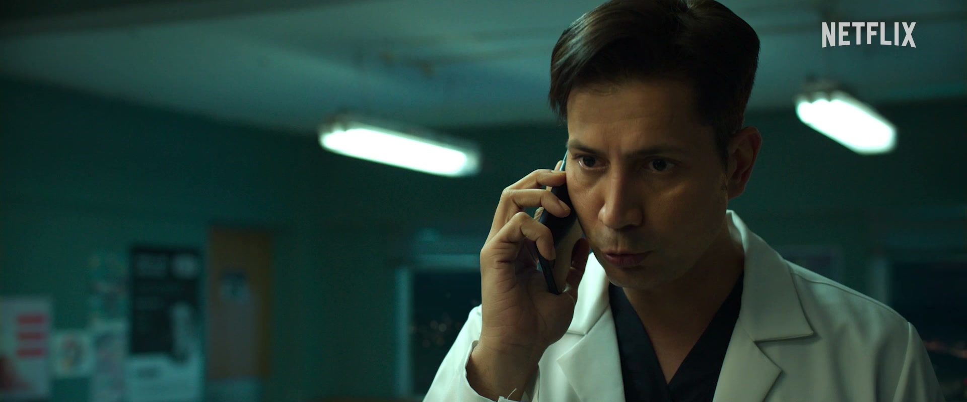 Sumeet Vyas as Dr Bhaskar talks on a phone in a hospital while wearing a white coat.