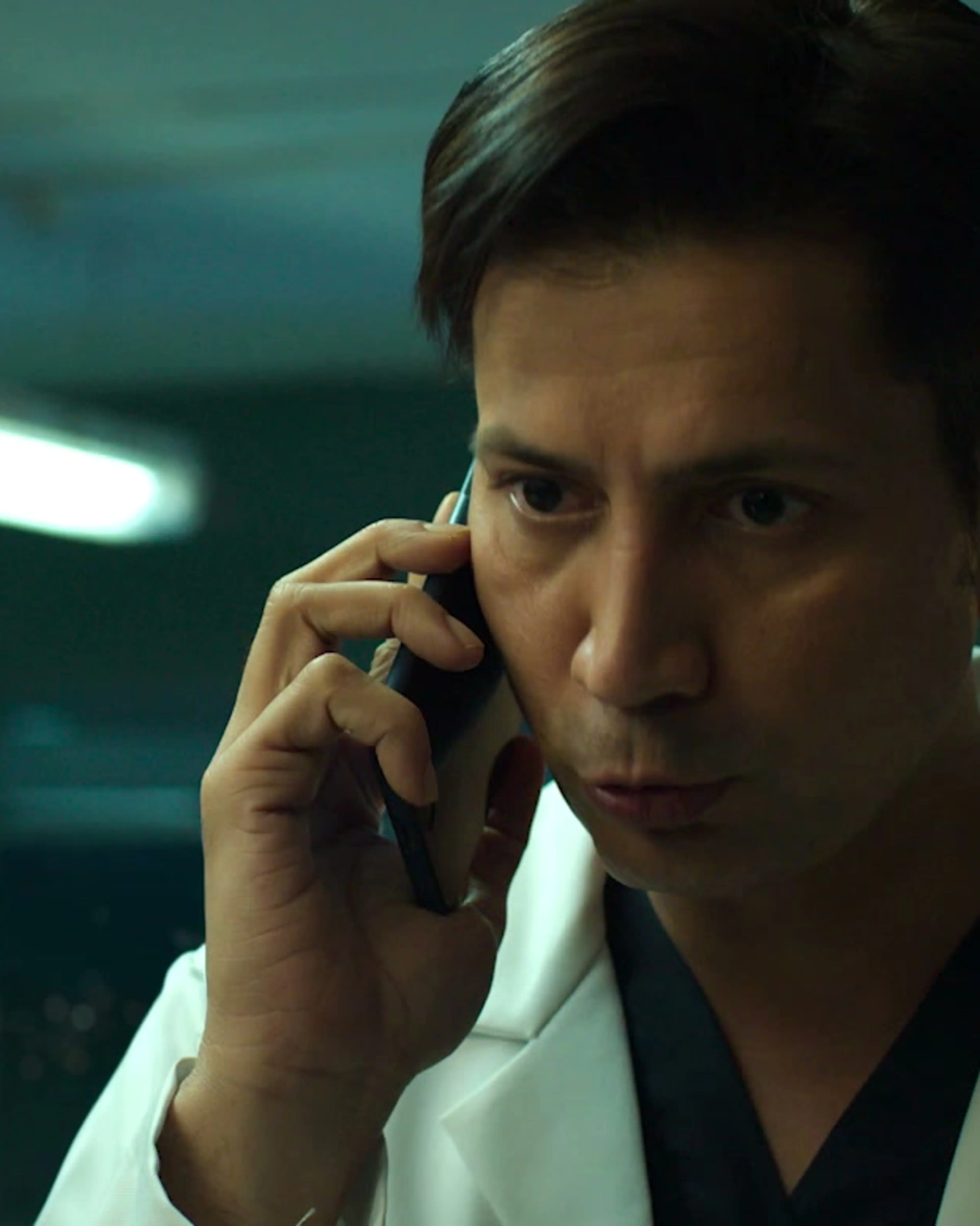 Sumeet Vyas as Dr Bhaskar talks on a phone in a hospital while wearing a white coat.
