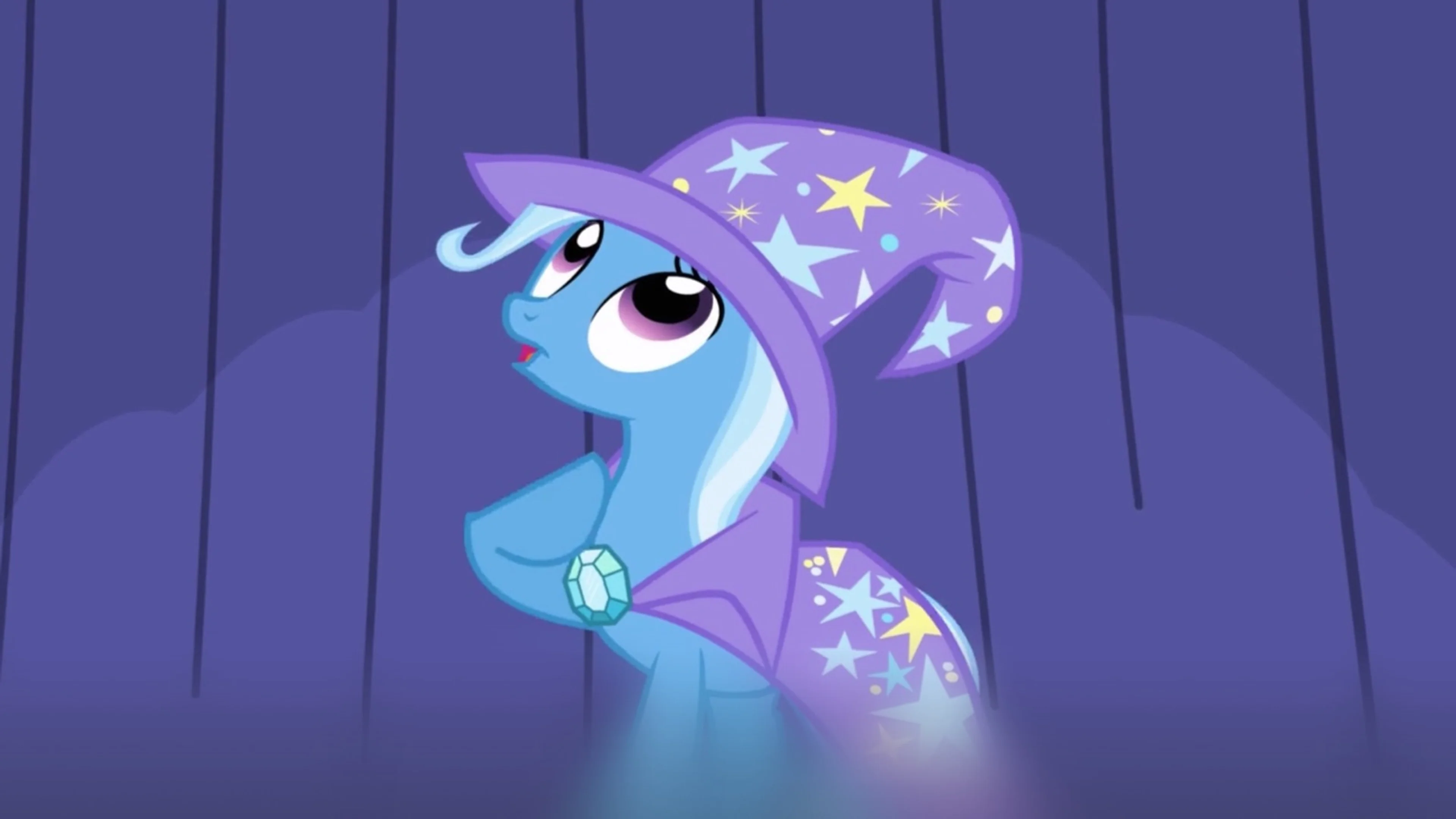 Trixie wears her star-patterned magician’s hat and cape.