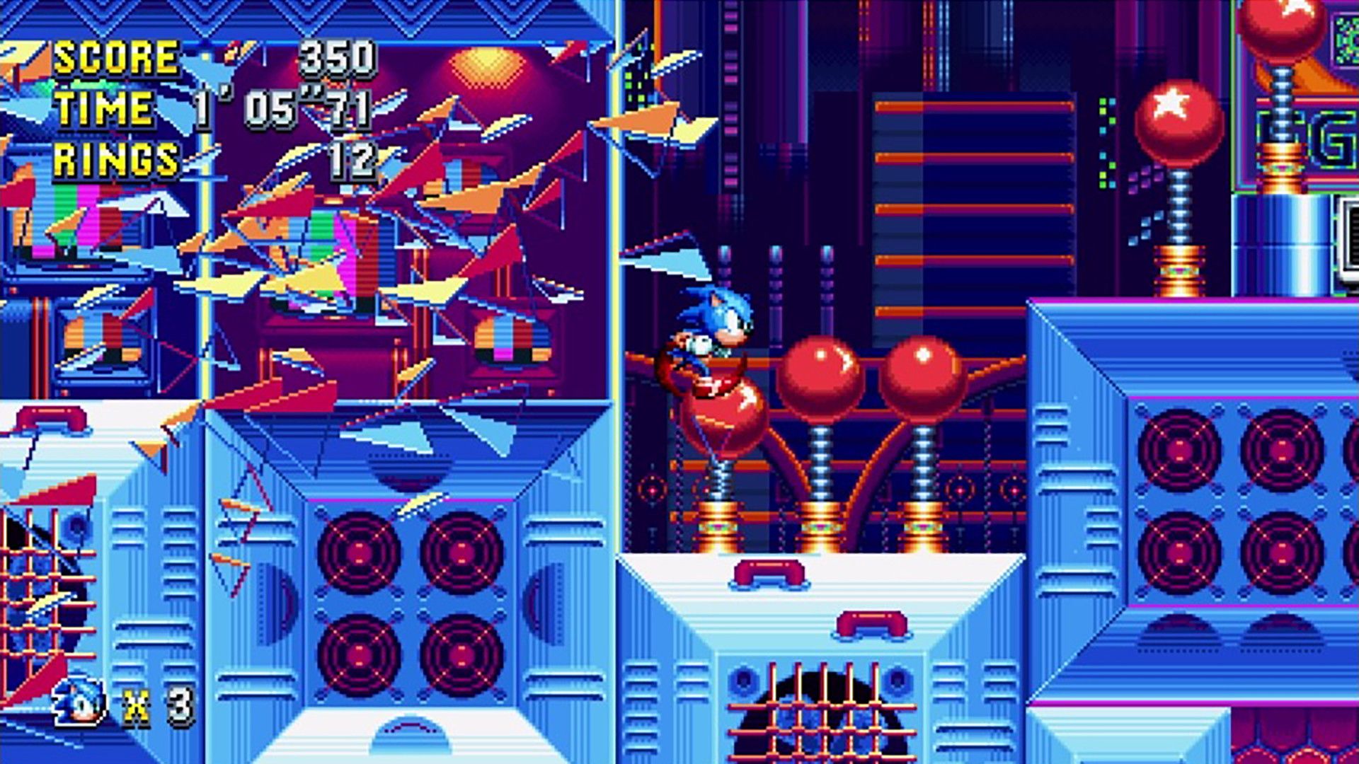 Sonic jumps past red balls and blue platforms in a colorful studio-themed stage.