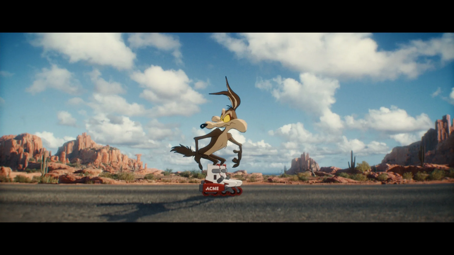 Wile E. Coyote balances on Acme rocket skates in the desert in Coyote vs. Acme.