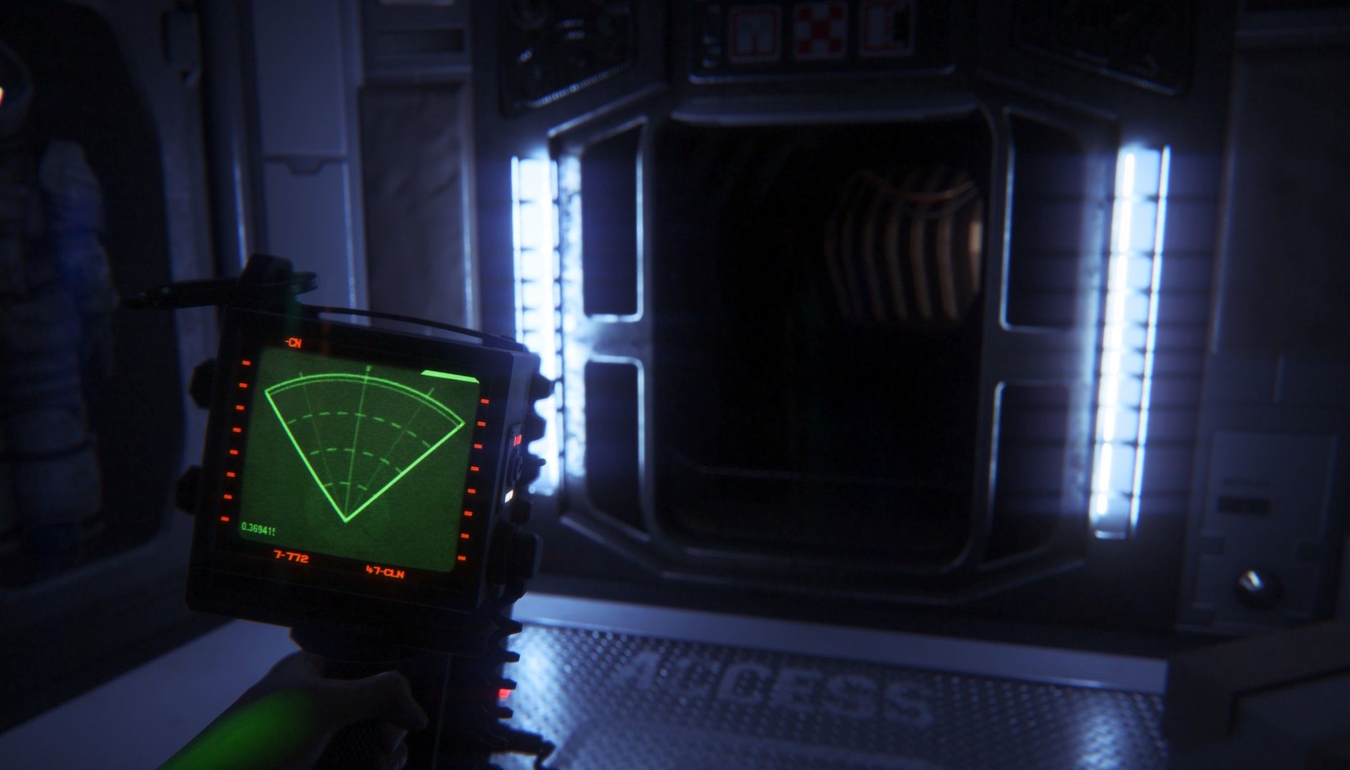 Amanda holds a green motion tracker while facing a bright corridor.