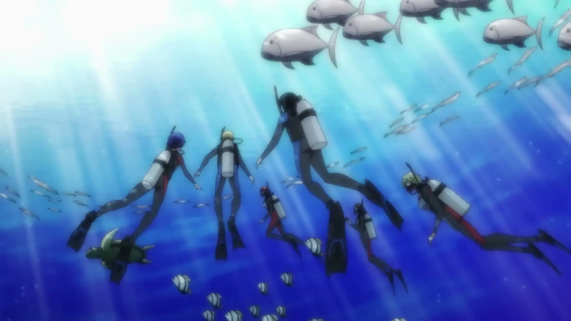 The Grand Blue Dreaming group dives through clear blue water.
