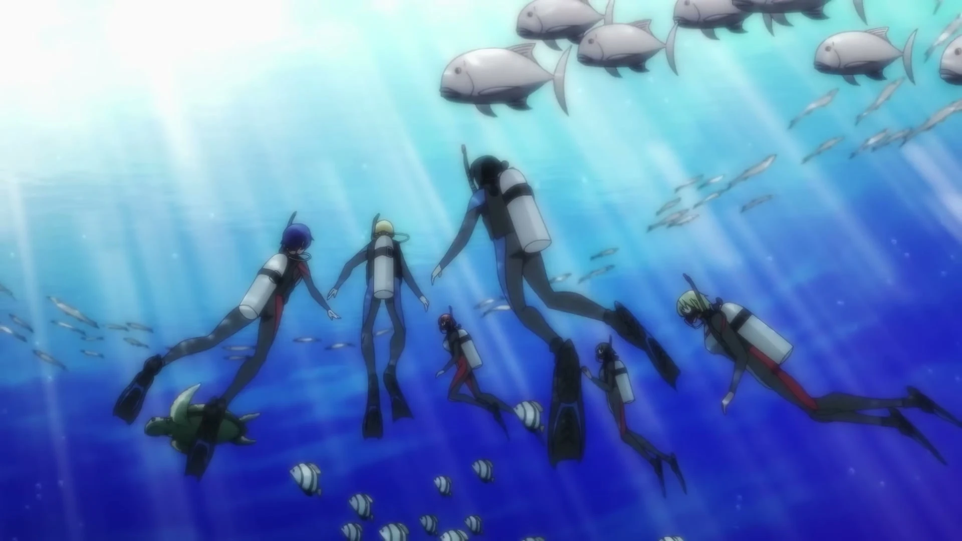 The Grand Blue Dreaming group dives through clear blue water.