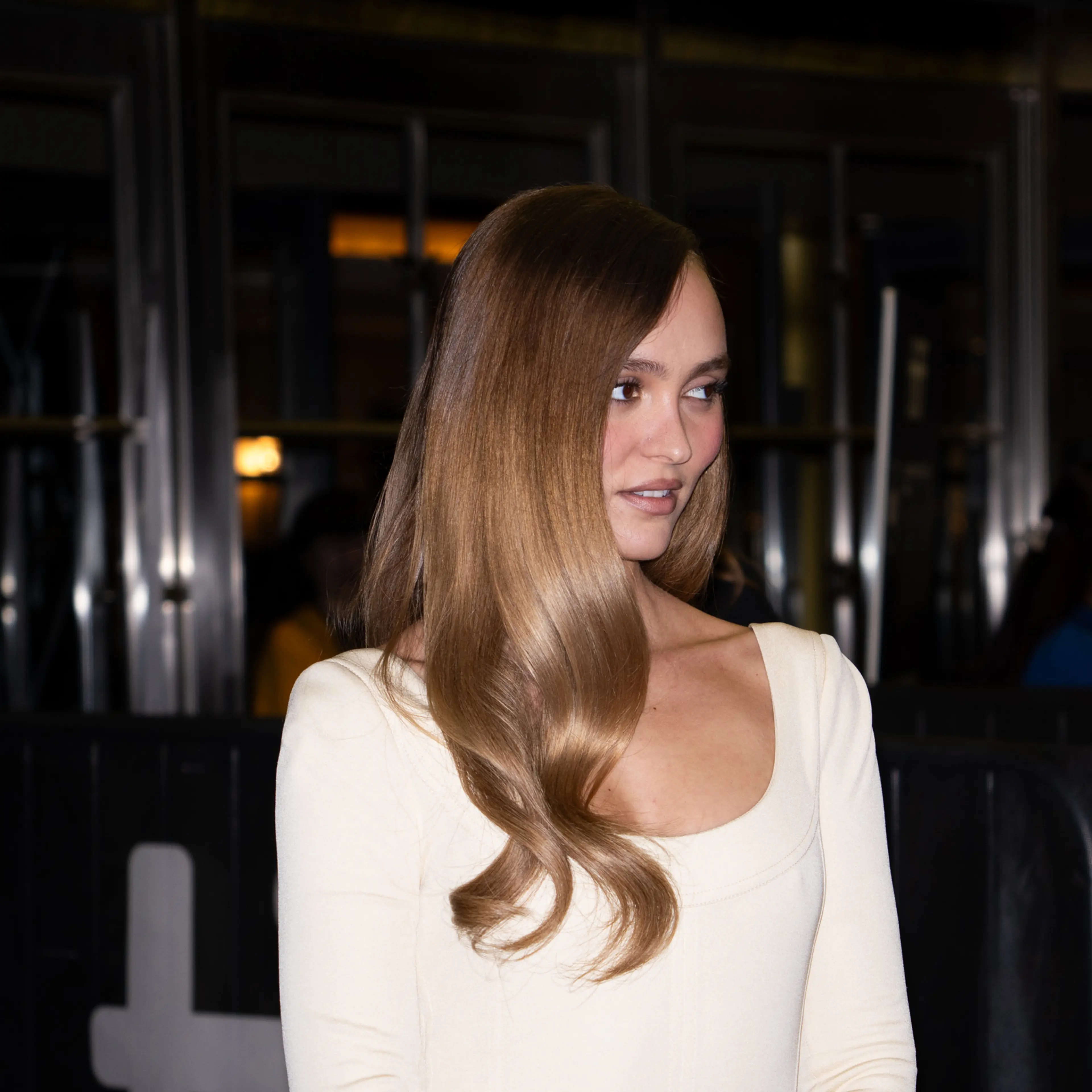 Lily-Rose Depp wears a white dress at the 2026 Toronto International Film Festival.
