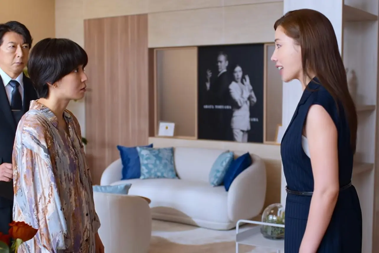 Mayu Matsuoka as Fumi and Riisa Naka as Rin face each other in a bright room at the clinic.