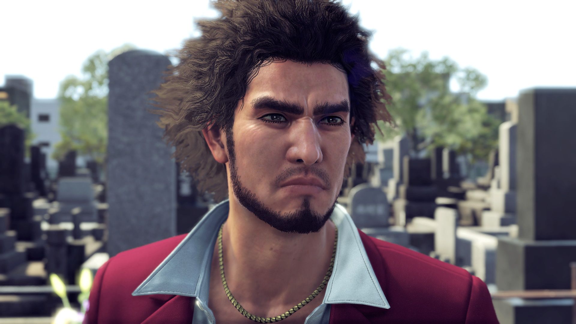 Ichiban Kasuga stands outdoors with a serious expression.